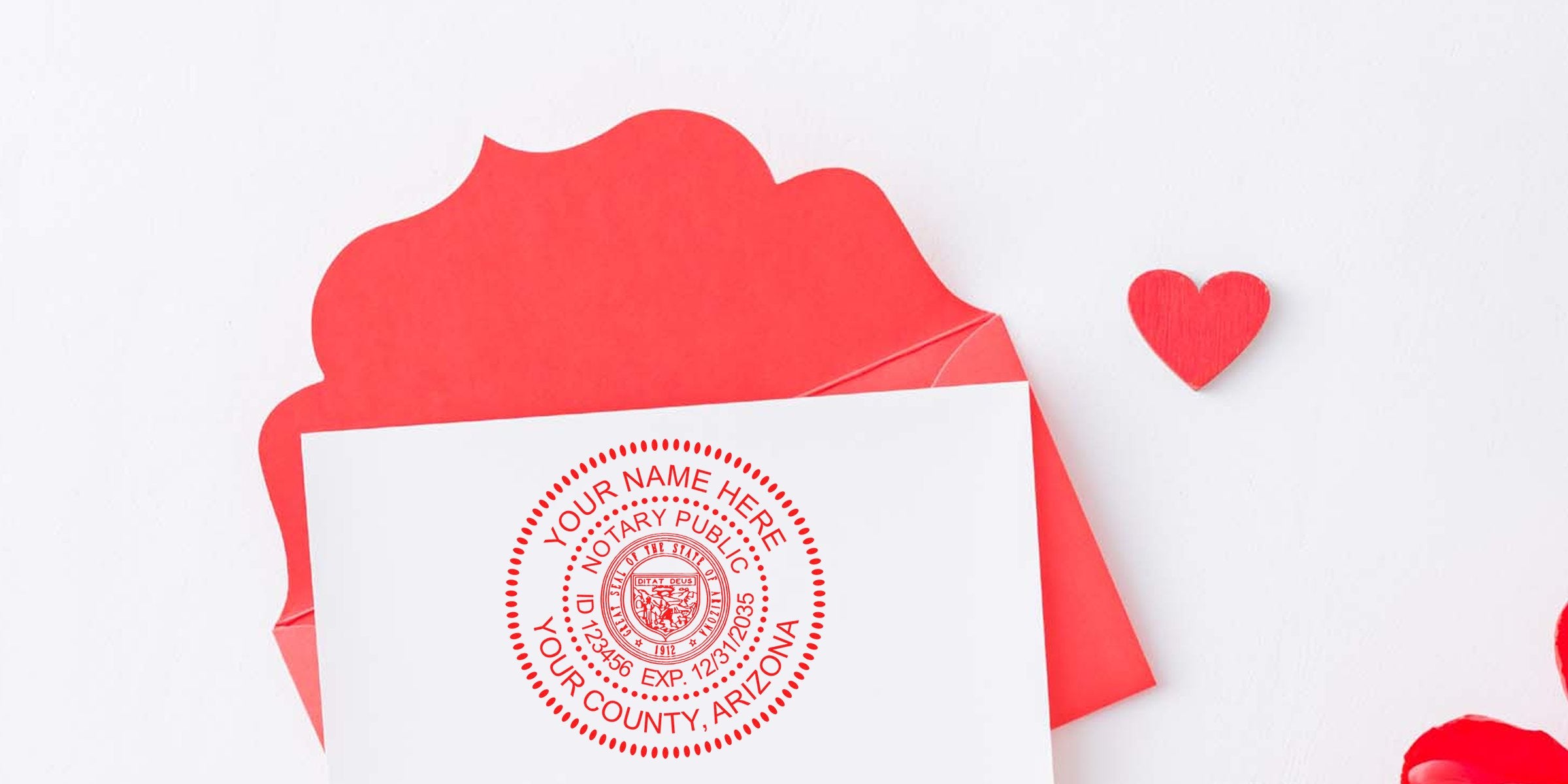 White card with red circular Arizona notary public seal stamped in center, tucked into scalloped red envelope next to small red wooden heart on white background — Valentine-themed notary stamp card image for legal or romantic stationery.