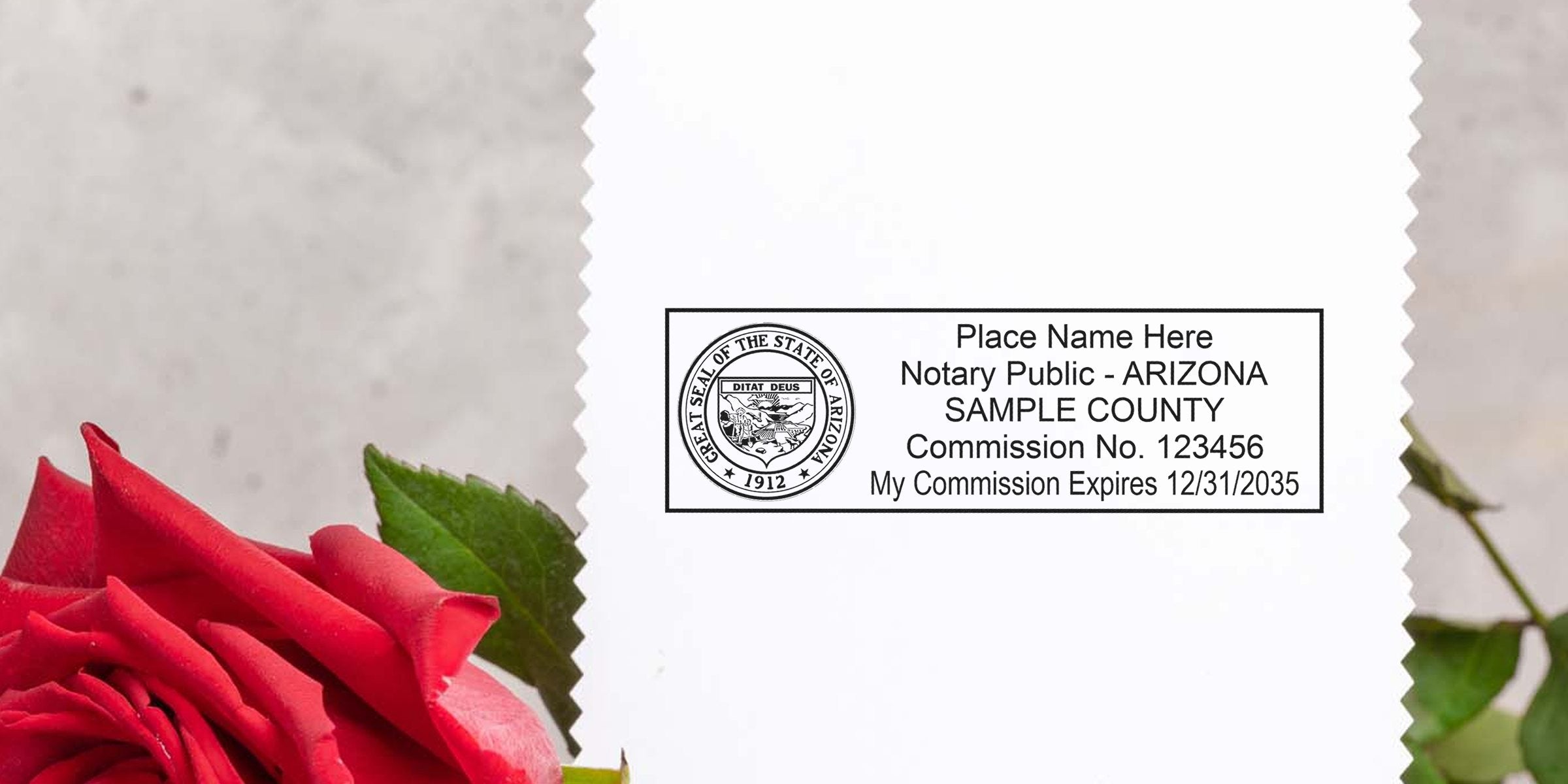 White card showing a sample Arizona notary public stamp with state seal printed in black on scalloped paper, red rose and green leaves beside it