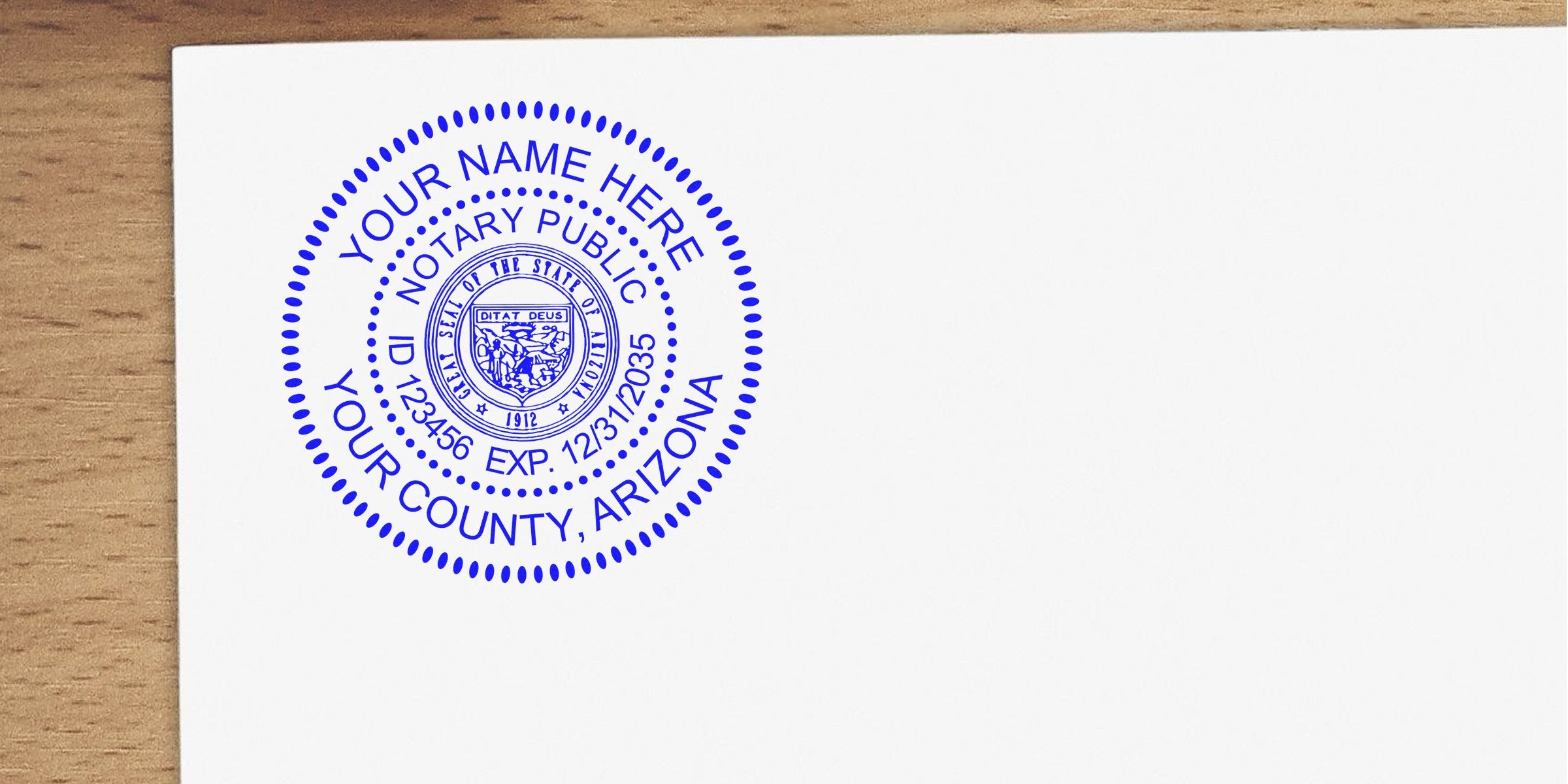 Blue circular notary public stamp on white paper with dotted border, state seal, placeholder name, ID number and expiration date, reading "Your County, Arizona," positioned near a wooden desk corner