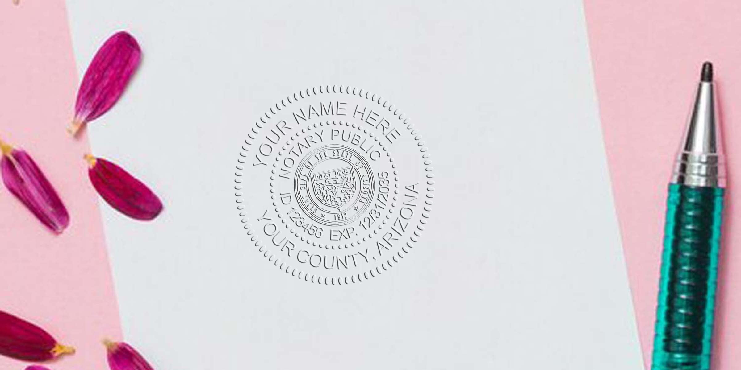 Embossed notary seal on white paper with teal pen and pink flower petals, close-up of official circular notary stamp impression