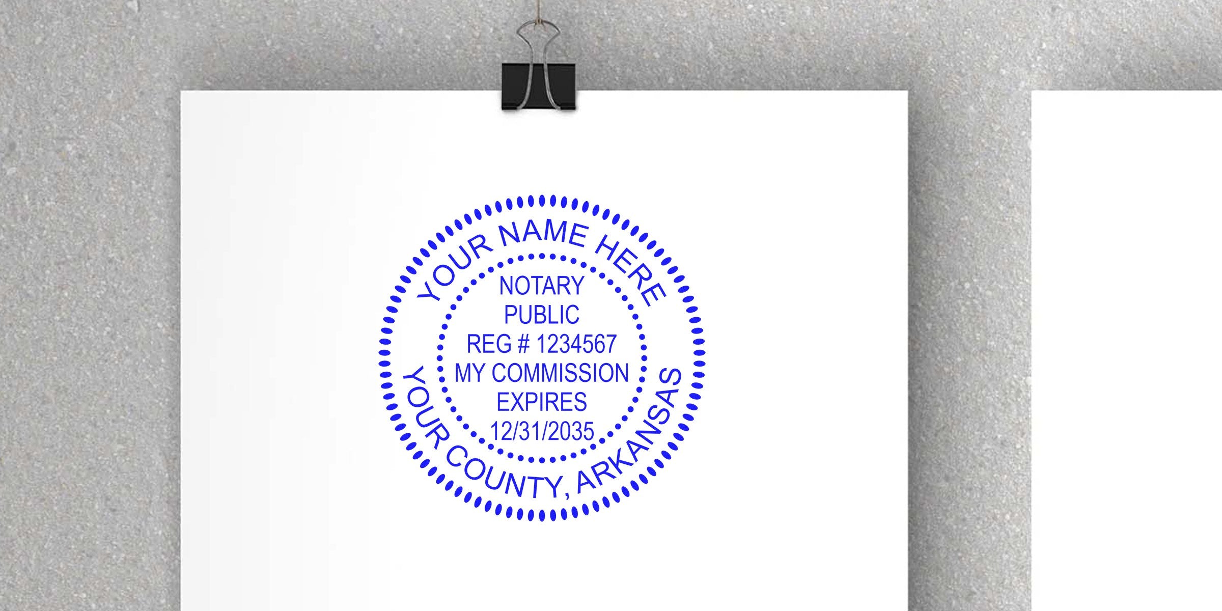 Blue round notary public stamp mockup on white paper, dotted circular seal reading "YOUR NAME HERE", registration number, county (Arkansas) and commission expiration date.