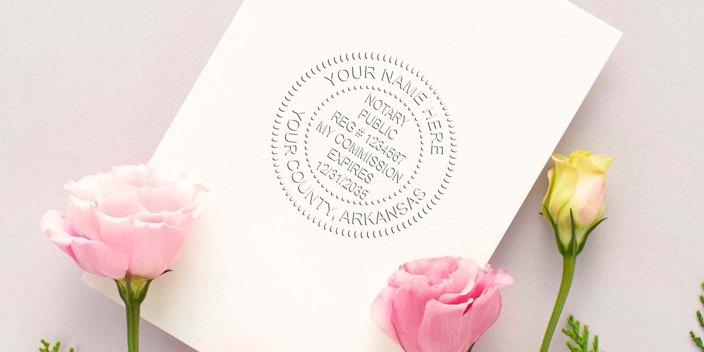 White card embossed with circular notary public seal mockup reading “Your Name Here, Your County, Arkansas,” surrounded by soft pink and pale-yellow lisianthus flowers on a light textured background
