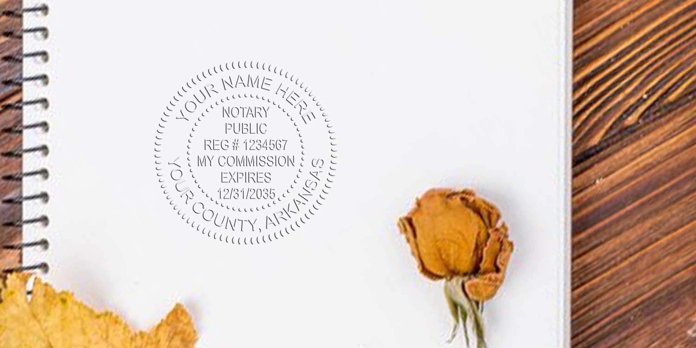 Spiral notebook page with embossed circular notary seal, dried rose and autumn leaf on a wooden table — flat lay showing vintage stationery, legal stamp detail and rustic office aesthetic.