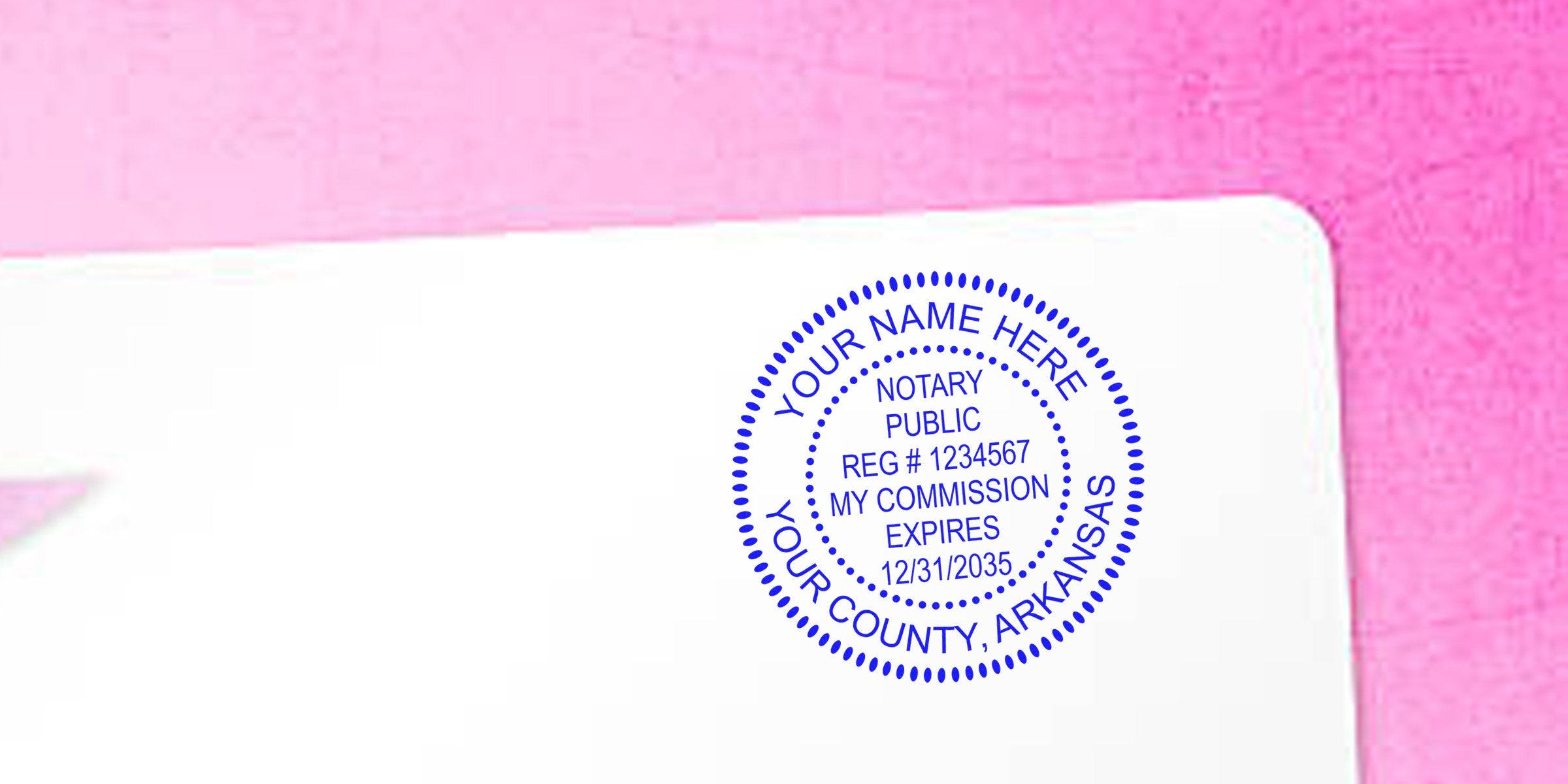 Blue circular notary public stamp on white paper with pink background, placeholder text "Your Name Here," county Arkansas, reg #1234567, commission expiration 12/31/2035