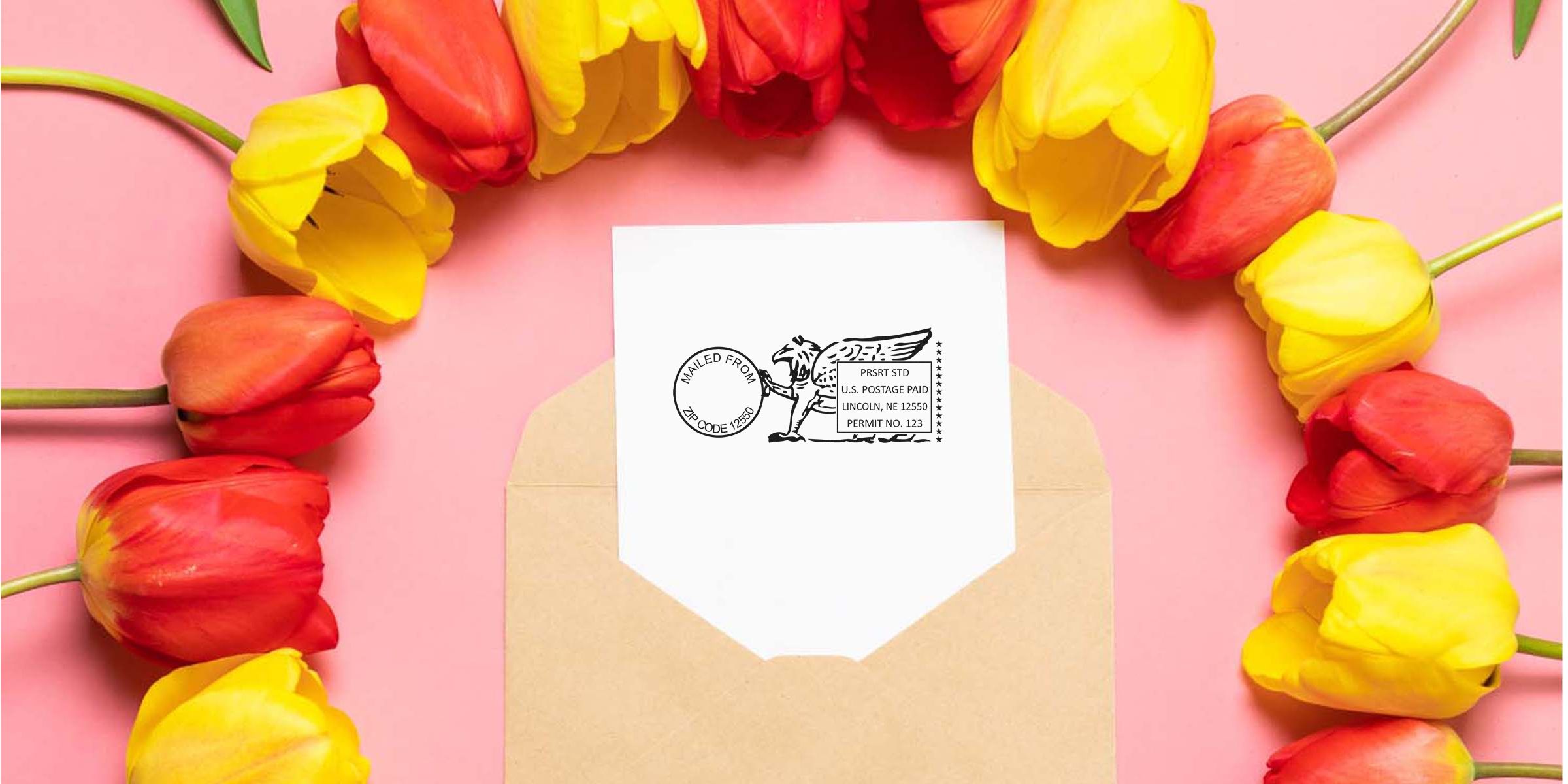 White greeting card with a postage-stamp illustration on an open brown envelope, surrounded by red and yellow tulips on a pink background.