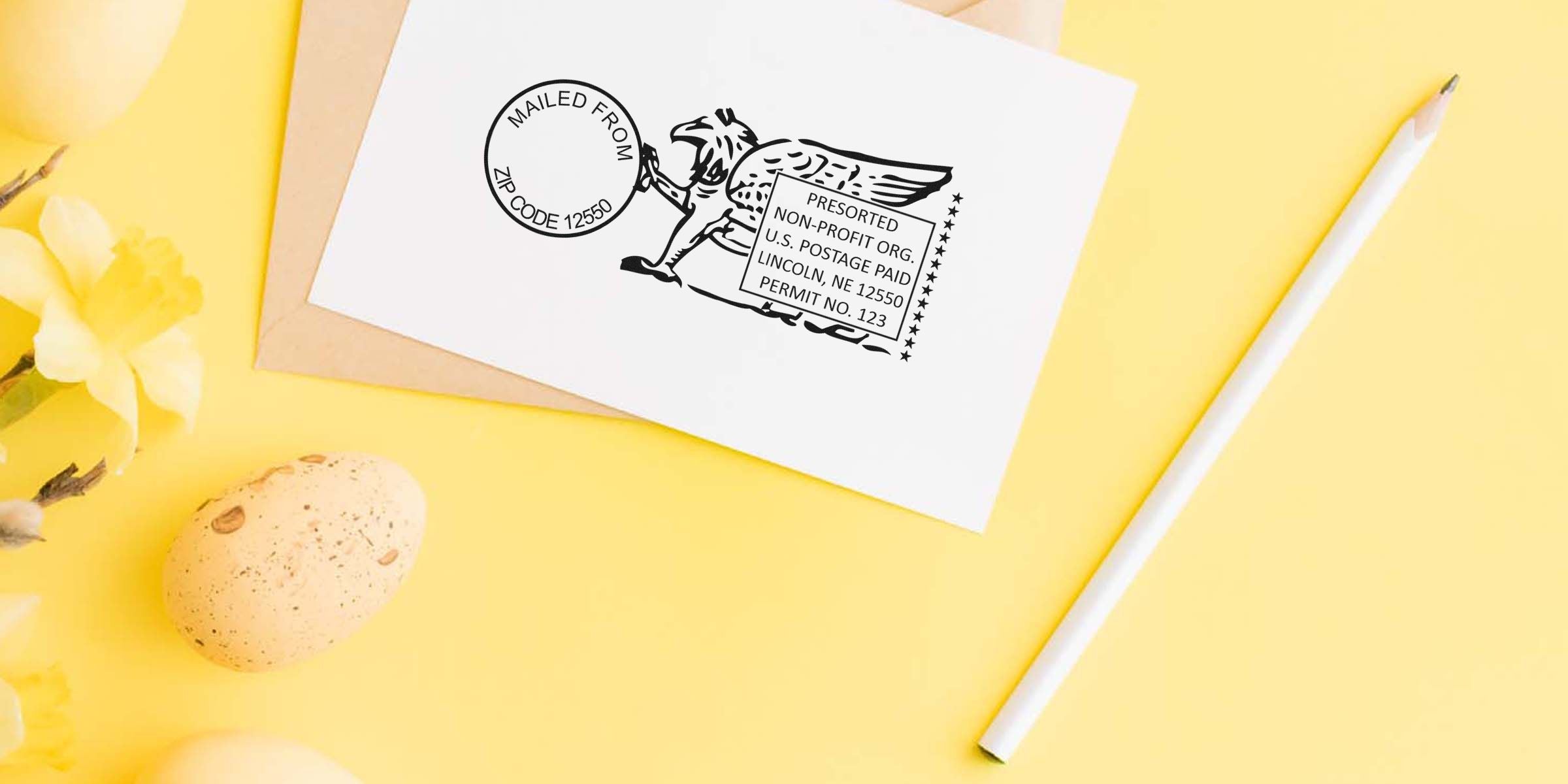 White greeting card with a black postal illustration on a yellow background, beside an egg and a white pencil.