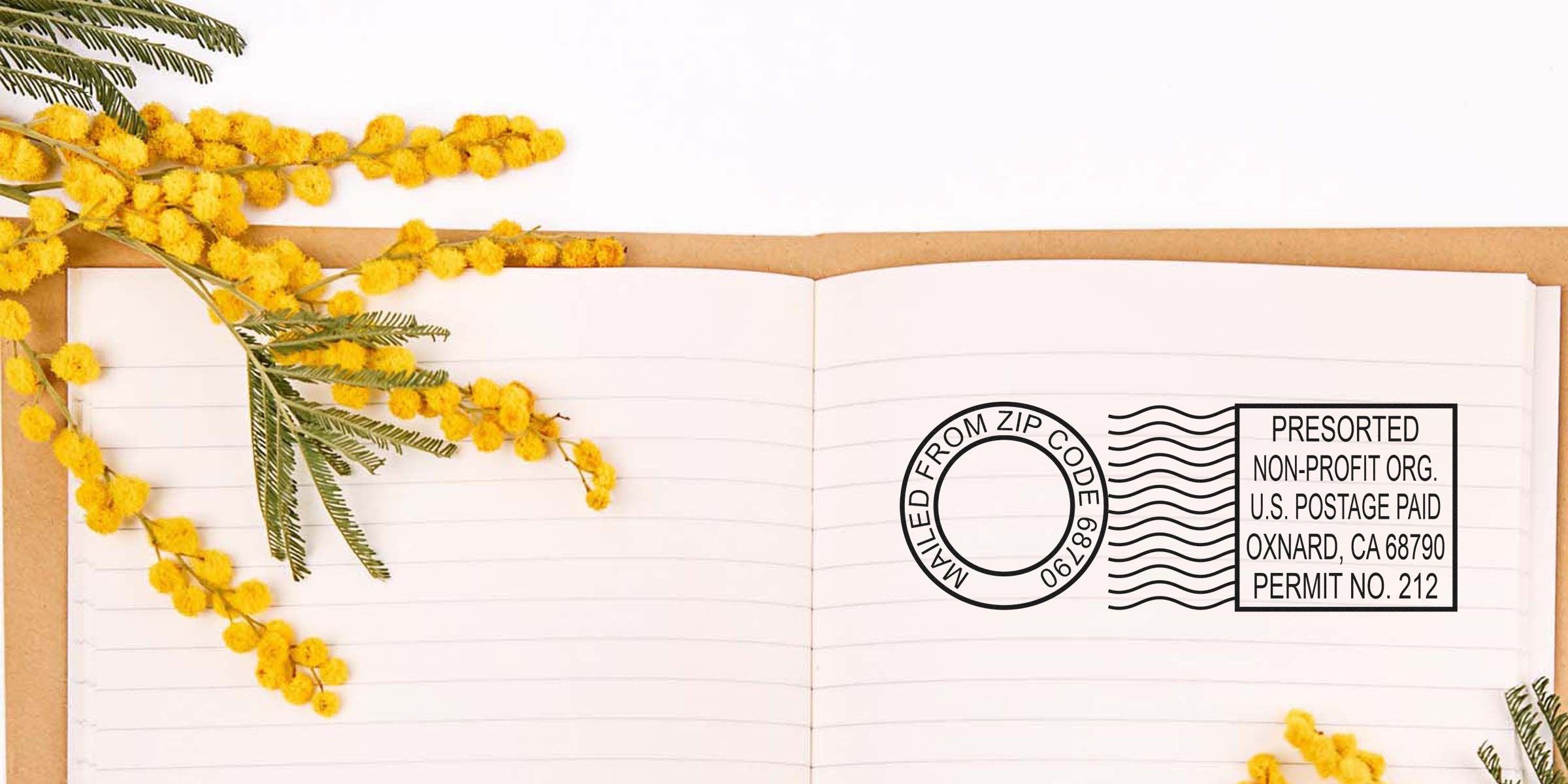 Open notebook with yellow mimosa flowers arranged along the left and bottom, and a black postage stamp illustration on the right page.