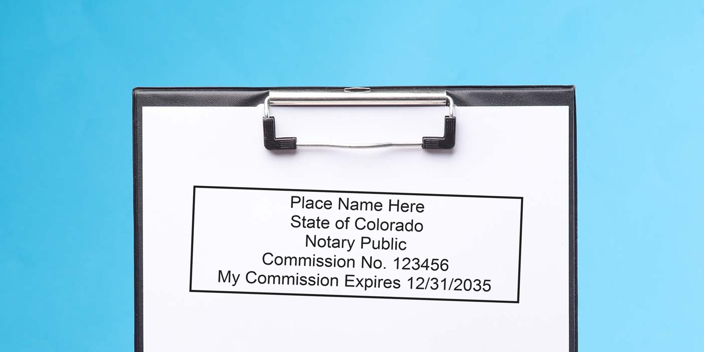 Clipboard showing a mock Colorado notary stamp on white paper: placeholder name, "State of Colorado Notary Public," commission no. 123456 and expiration date 12/31/2035, clipped to a black clipboard on a blue background