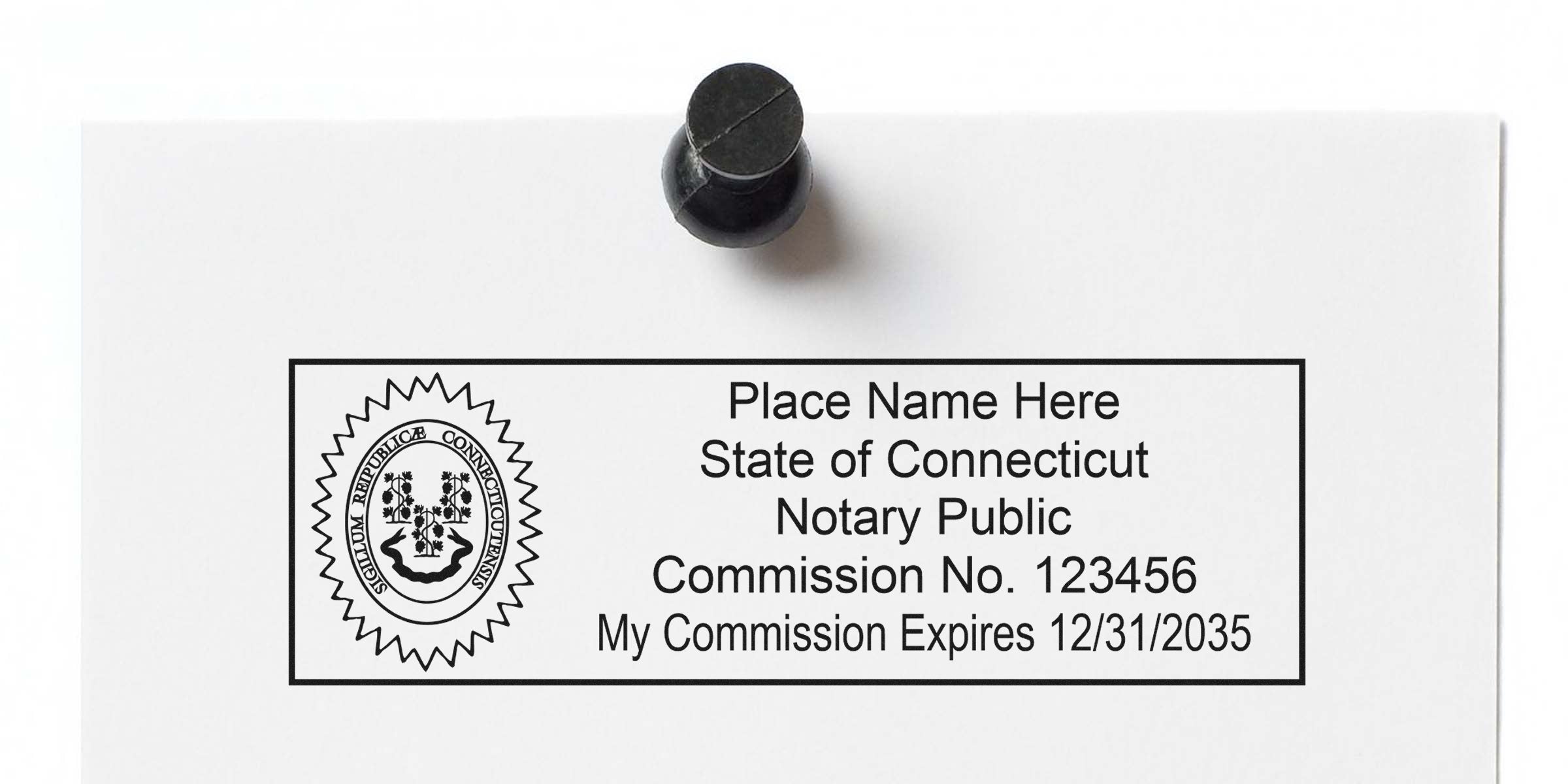 Connecticut notary public commission stamp template with state seal, placeholder name, commission number and expiration date 12/31/2035 inside a black rectangular border, shown pinned to white paper.