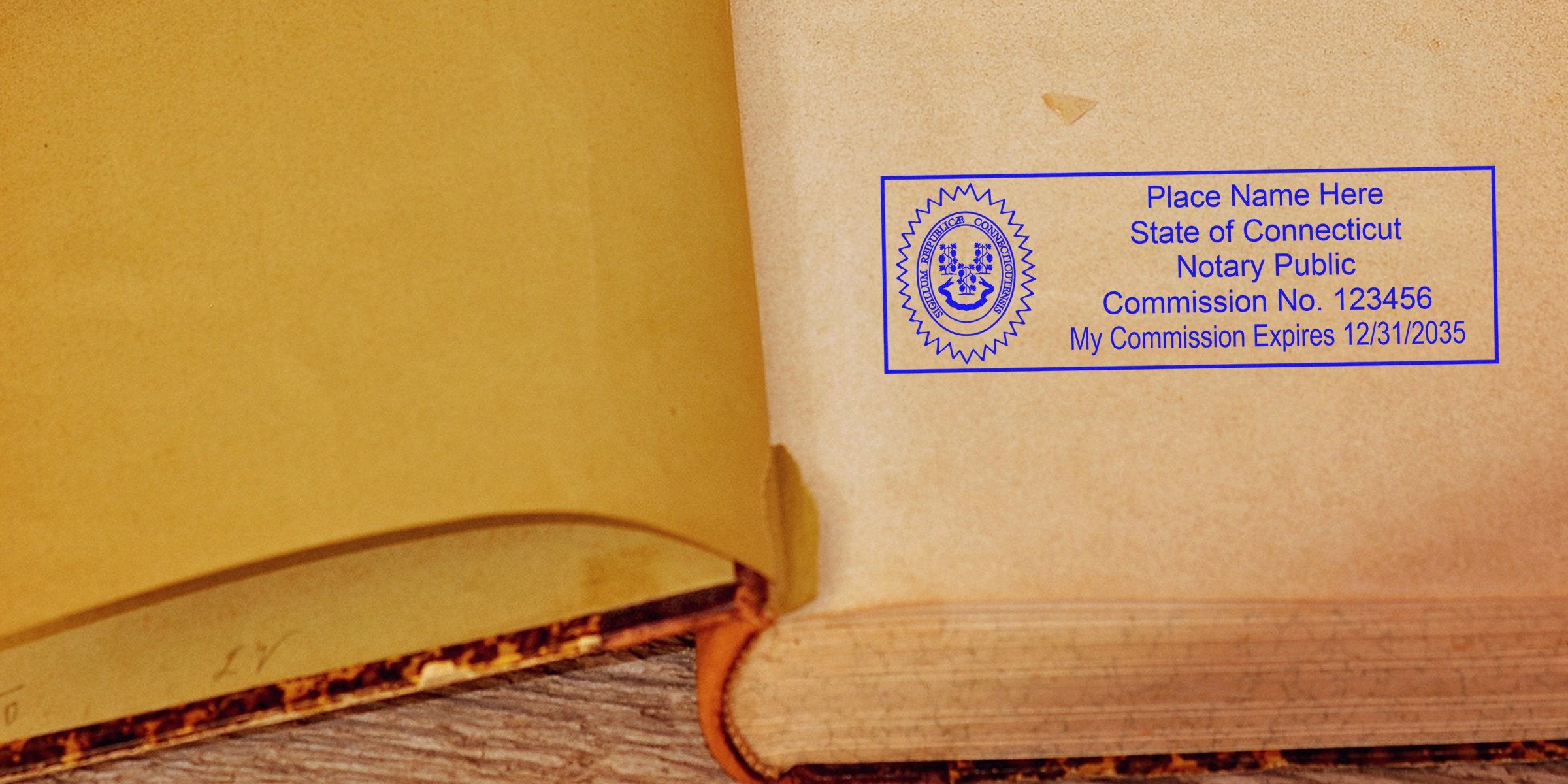 Open antique book with yellowed pages and a blue Connecticut notary public stamp and commission seal on the inner cover.