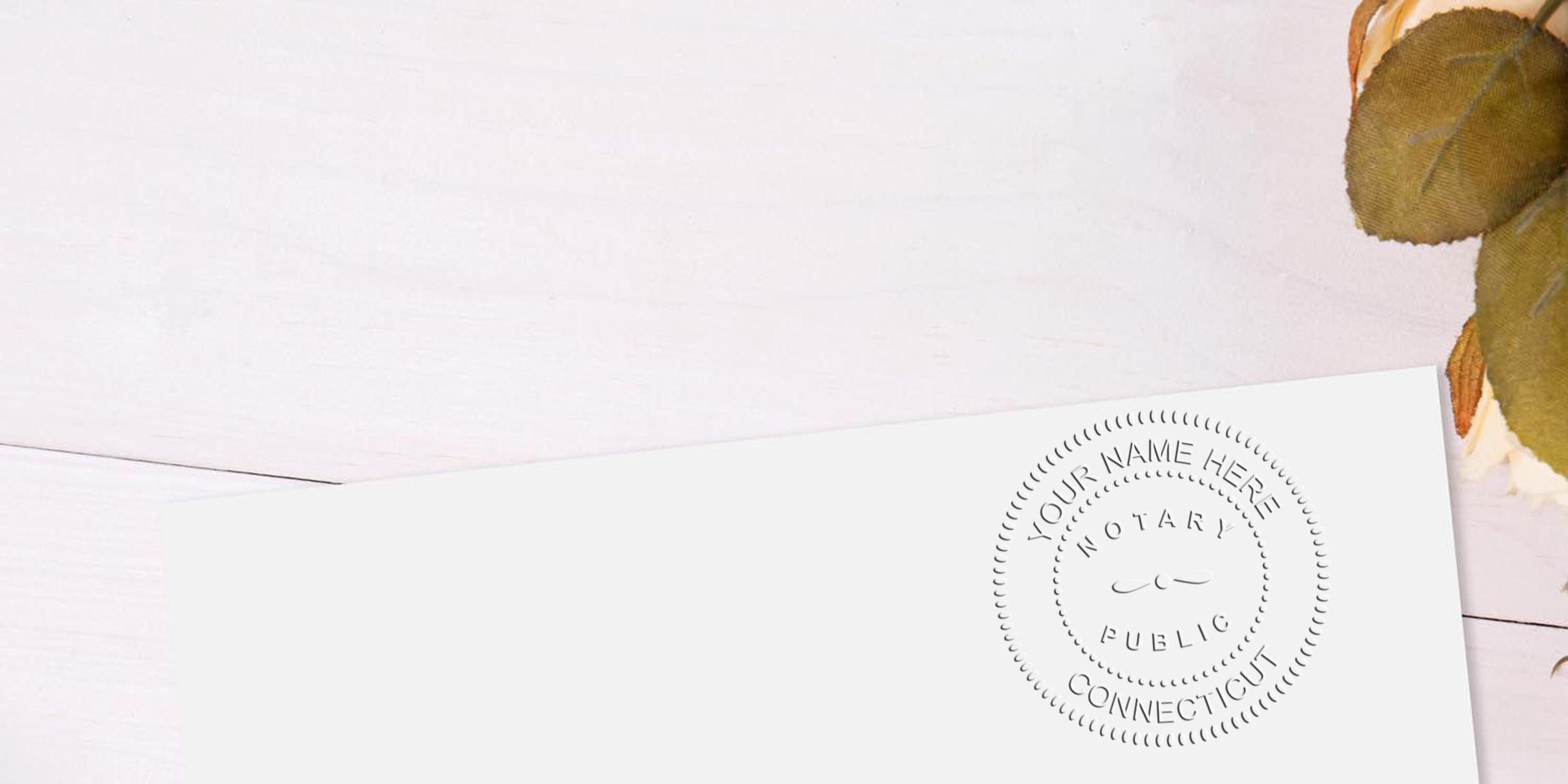 Embossed notary public seal reading "Your Name Here – Connecticut" on white stationery corner, minimalist flatlay with dried leaves, legal document mockup