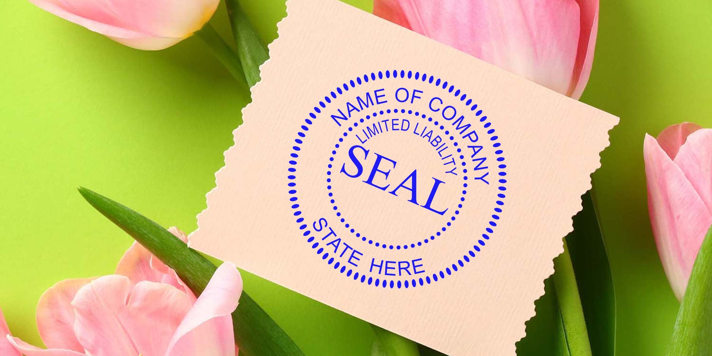 Beige card with a blue circular “SEAL” stamp placed among pink tulips.