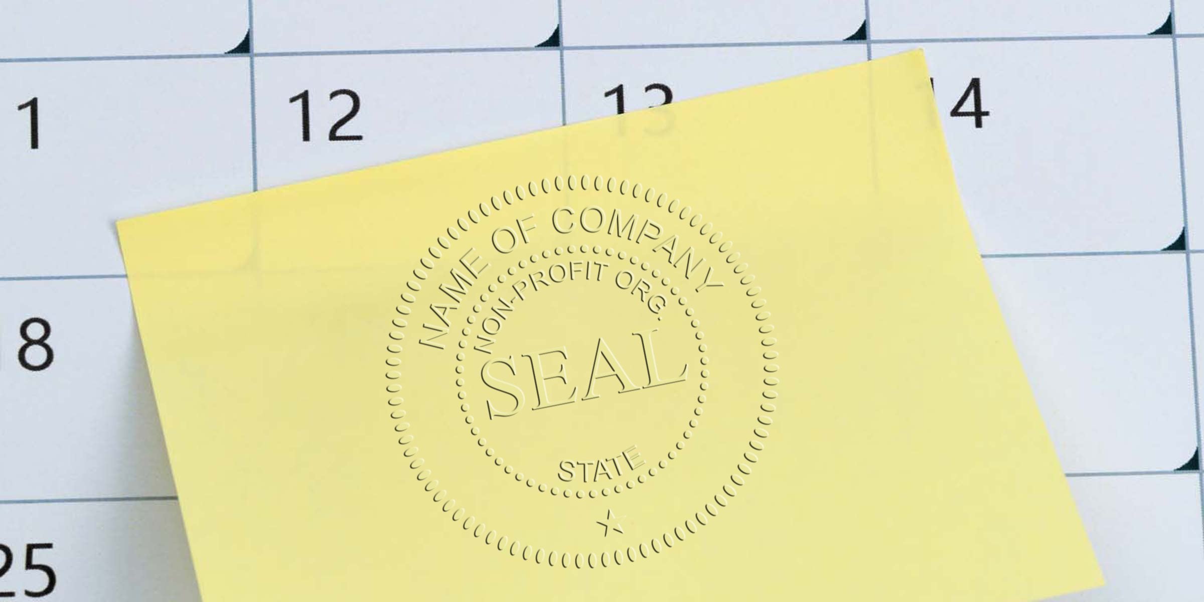 Close-up of a yellow seal card labeled SEAL placed over a calendar grid showing the numbers 1, 12, 13, and 14.