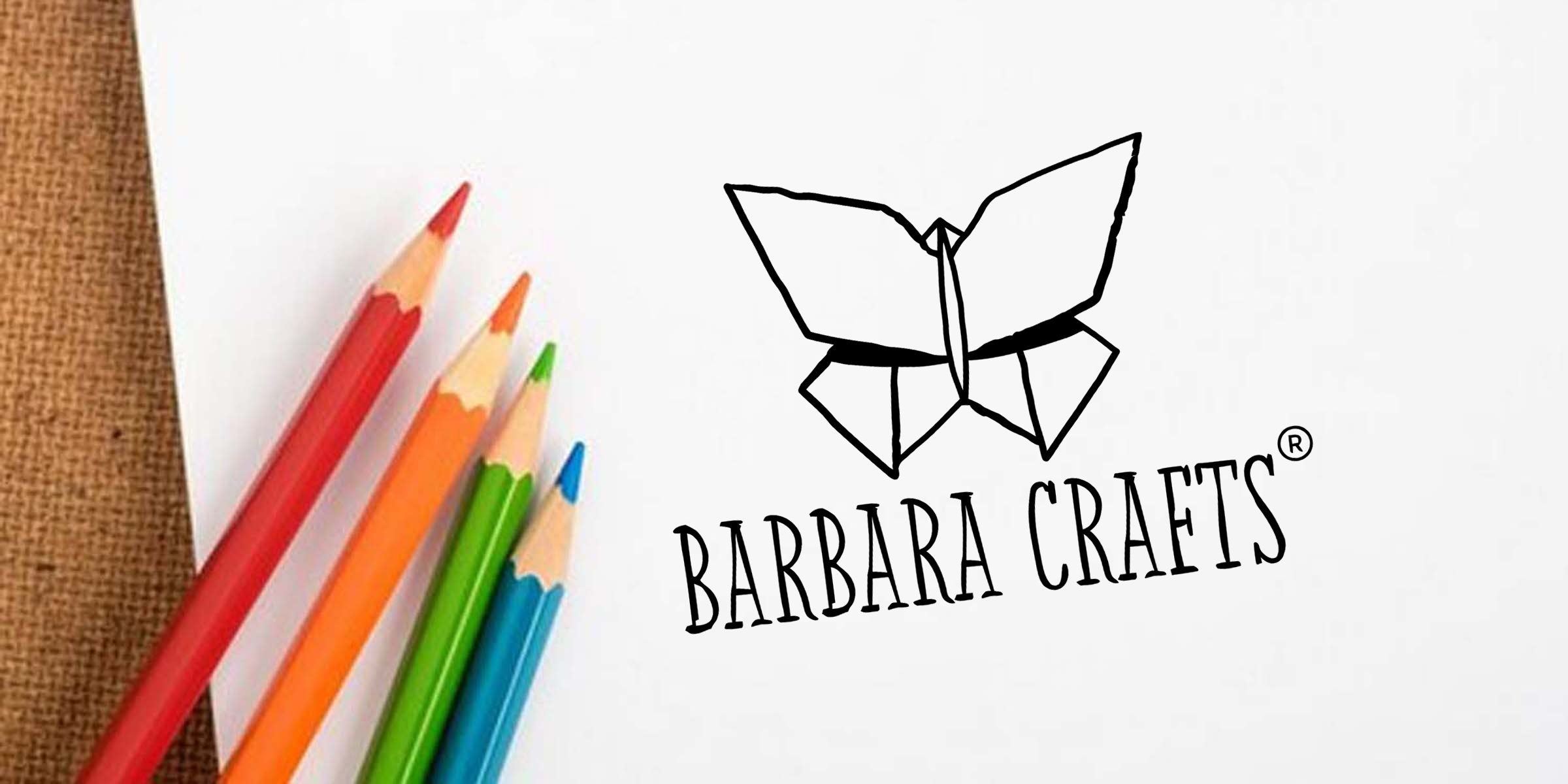White paper with red, orange, green, blue colored pencils on burlap next to Barbara Crafts logo featuring a hand-drawn origami butterfly and stylized text — craft branding, art supplies, DIY project concept