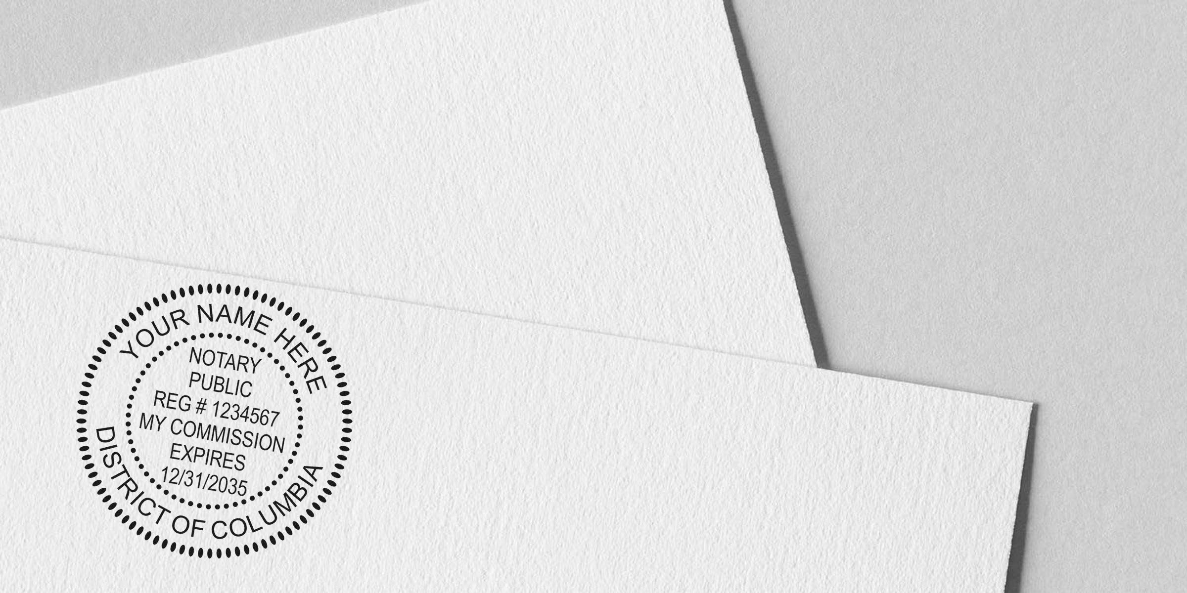Close-up of a circular notary public stamp imprint on textured white paper showing registration number, commission expiration date and "District of Columbia" — professional notary seal for legal documents and certification.