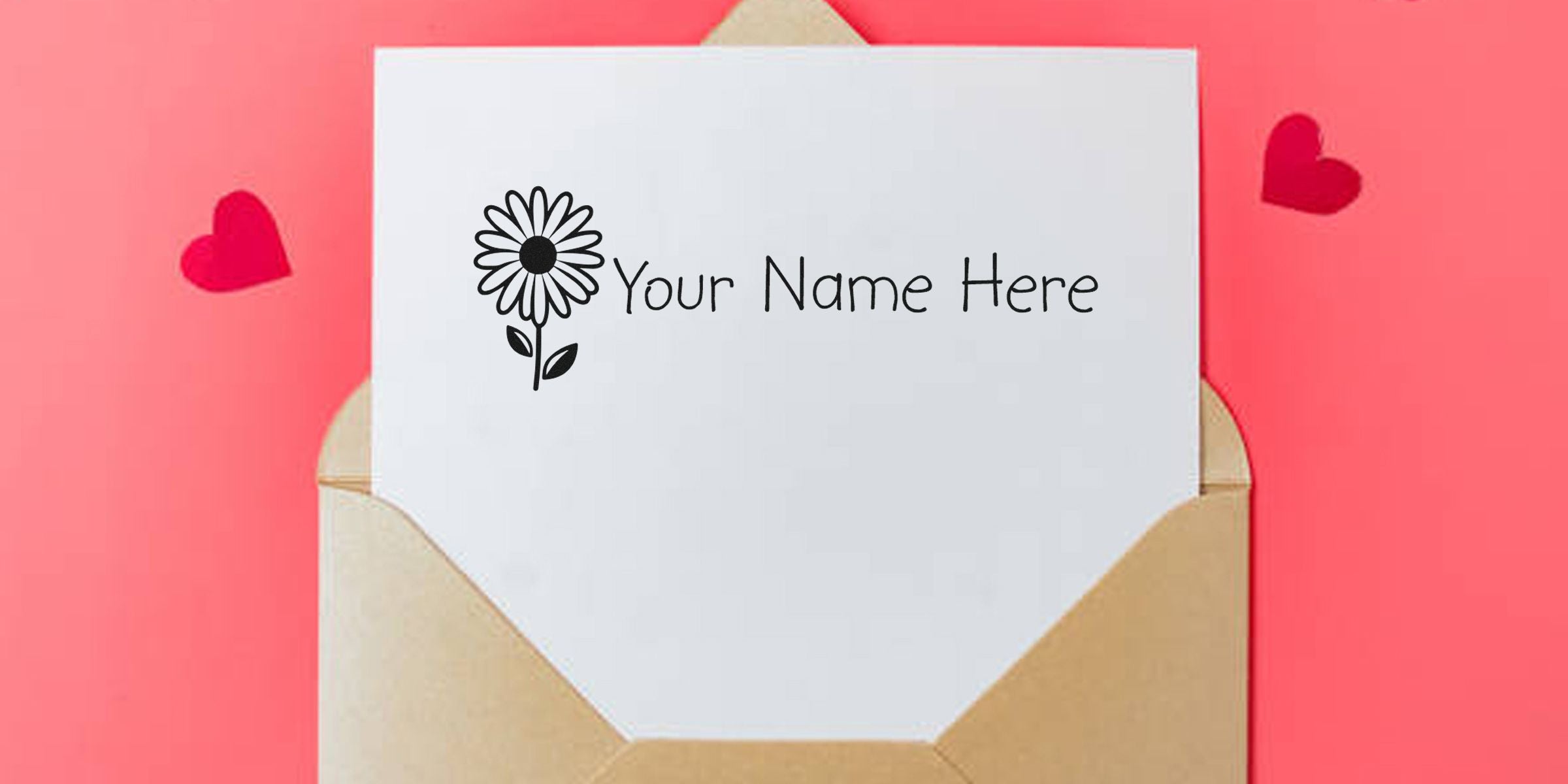 Card with a daisylike flower illustration and the text “Your Name Here” on white paper inside a beige envelope against a pink background.