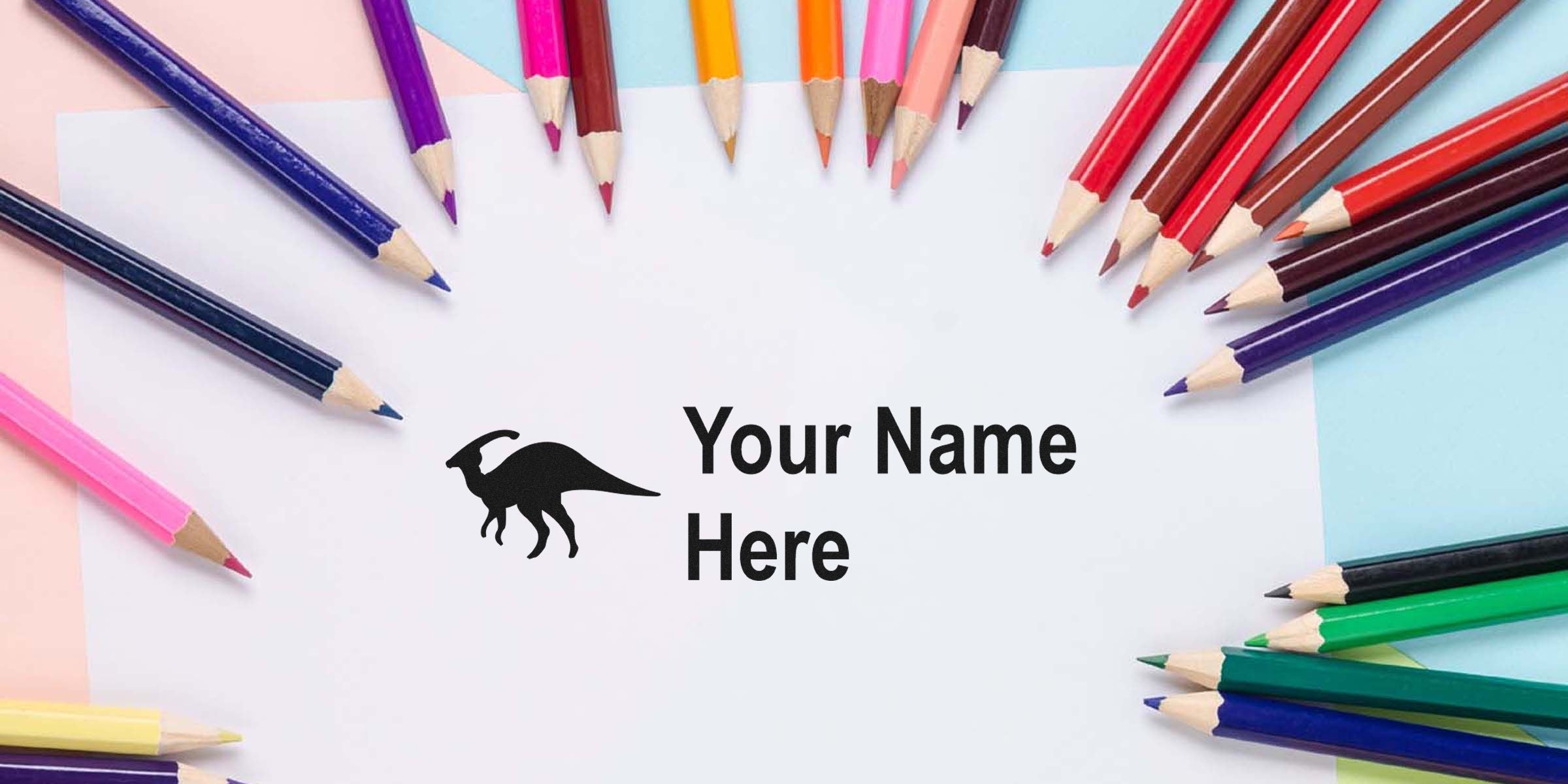 Colorful pencils arranged around a white card reading “Your Name Here.”