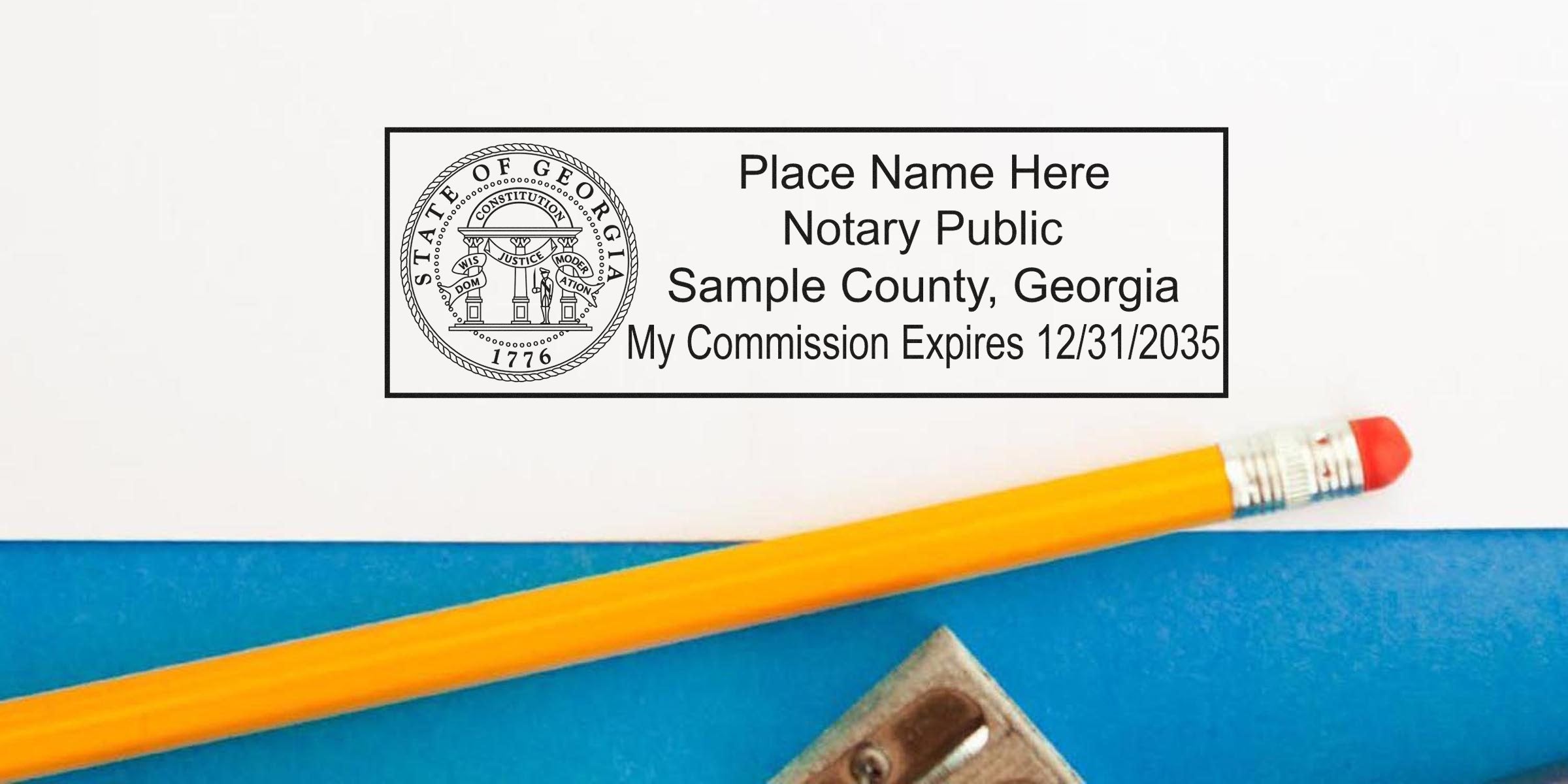Georgia notary public stamp mockup on white paper reading "Sample County, Georgia" with pencil and pencil sharpener on blue background