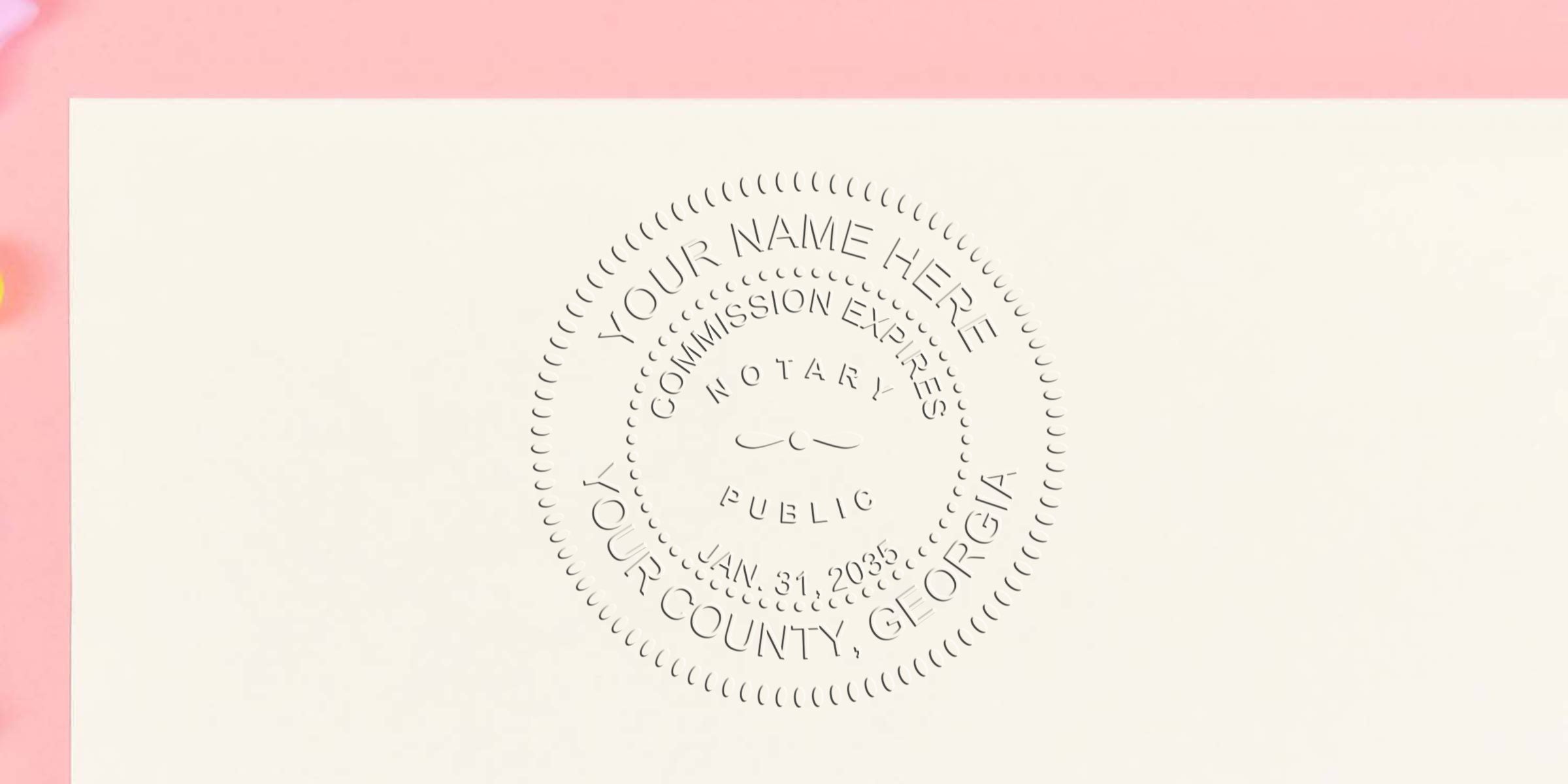 Embossed circular notary public seal impression on cream stationery with pale pink border, decorative scalloped edge and stamped text indicating commission and county details.