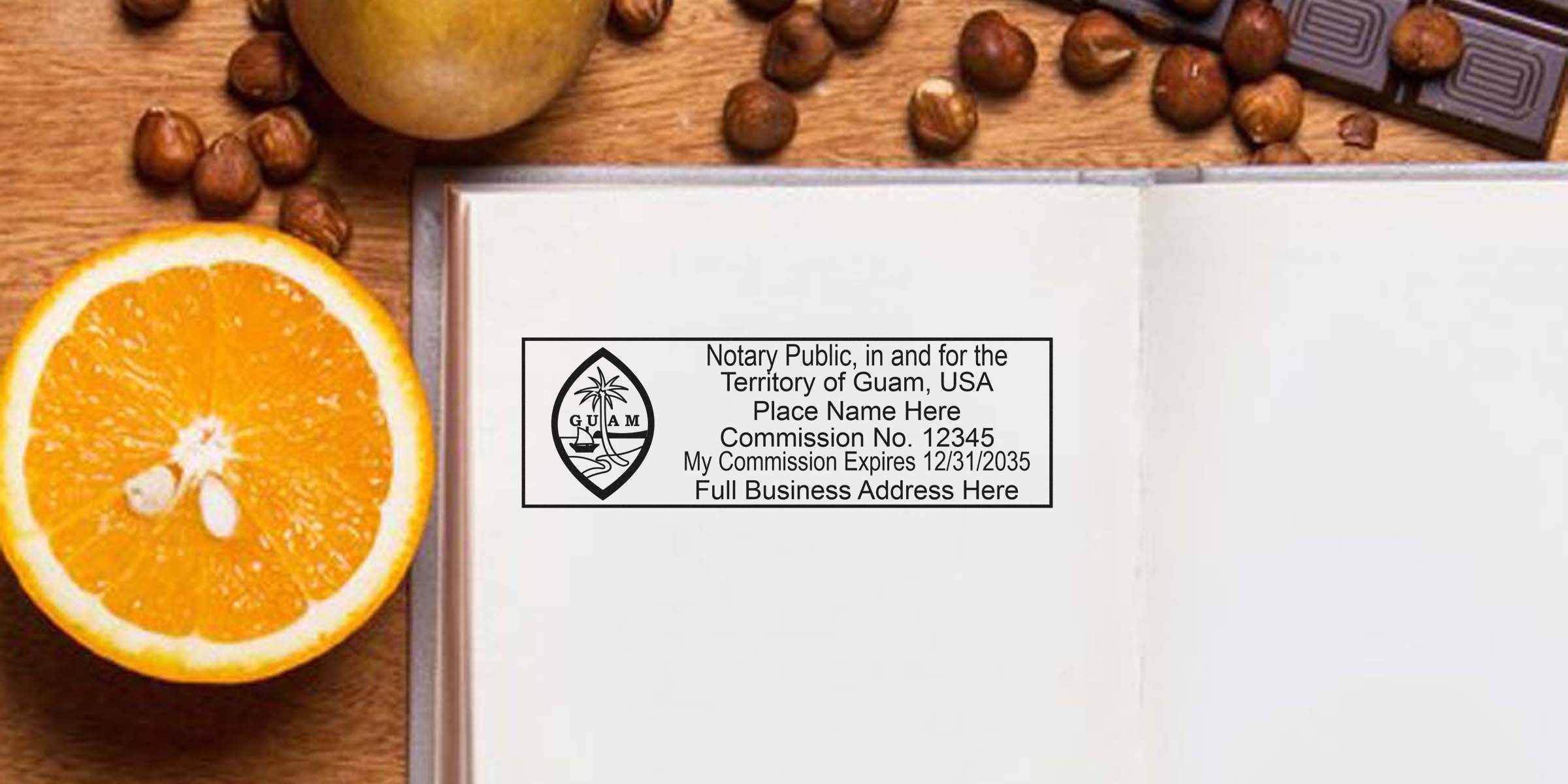 Open notebook with Guam notary public stamp imprint mockup on blank page beside halved orange, hazelnuts and chocolate on wooden desk — office stationery scene