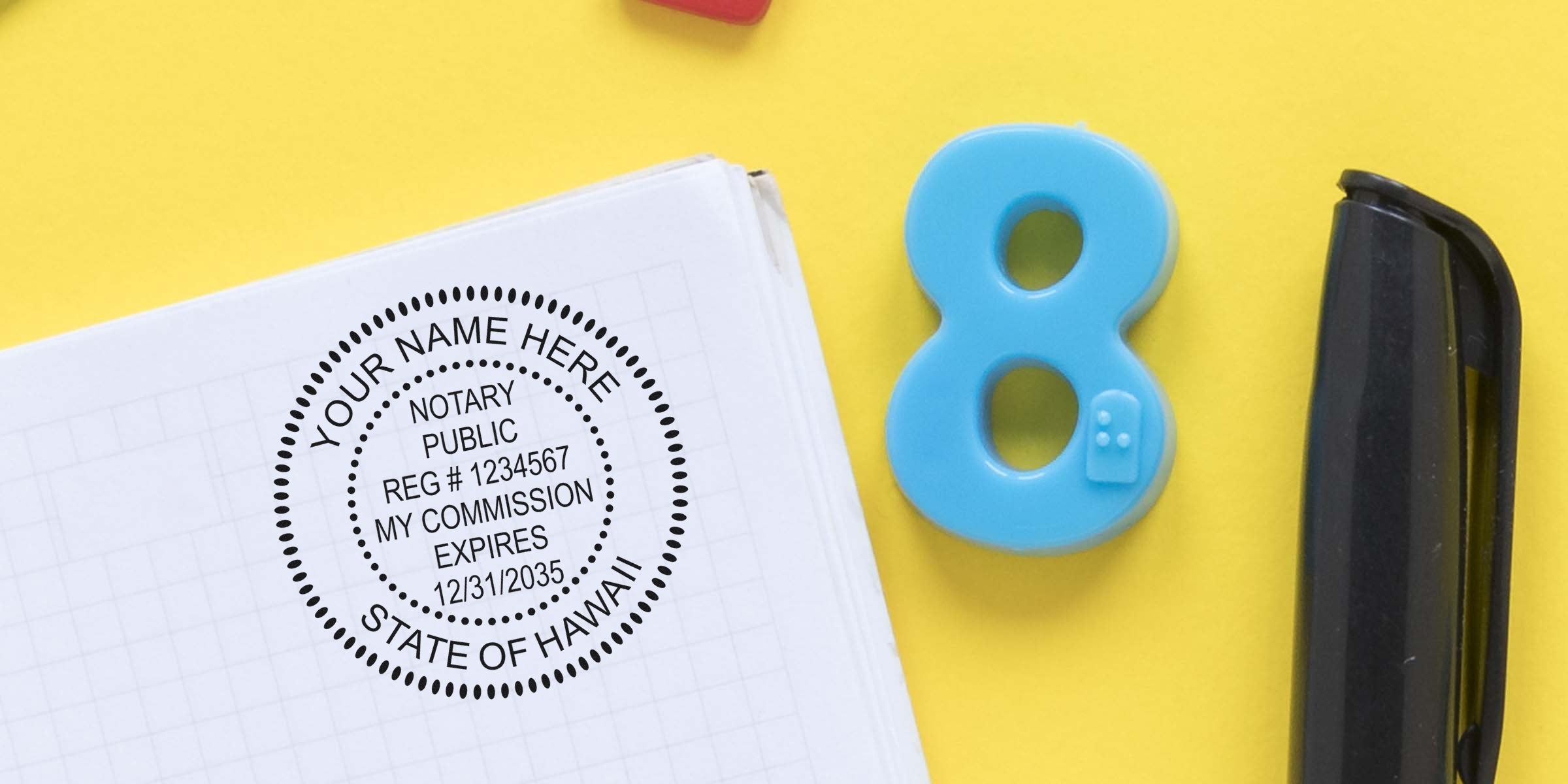 Notary public round stamp imprint on grid notebook page beside a blue plastic number 8 and black pen on bright yellow background