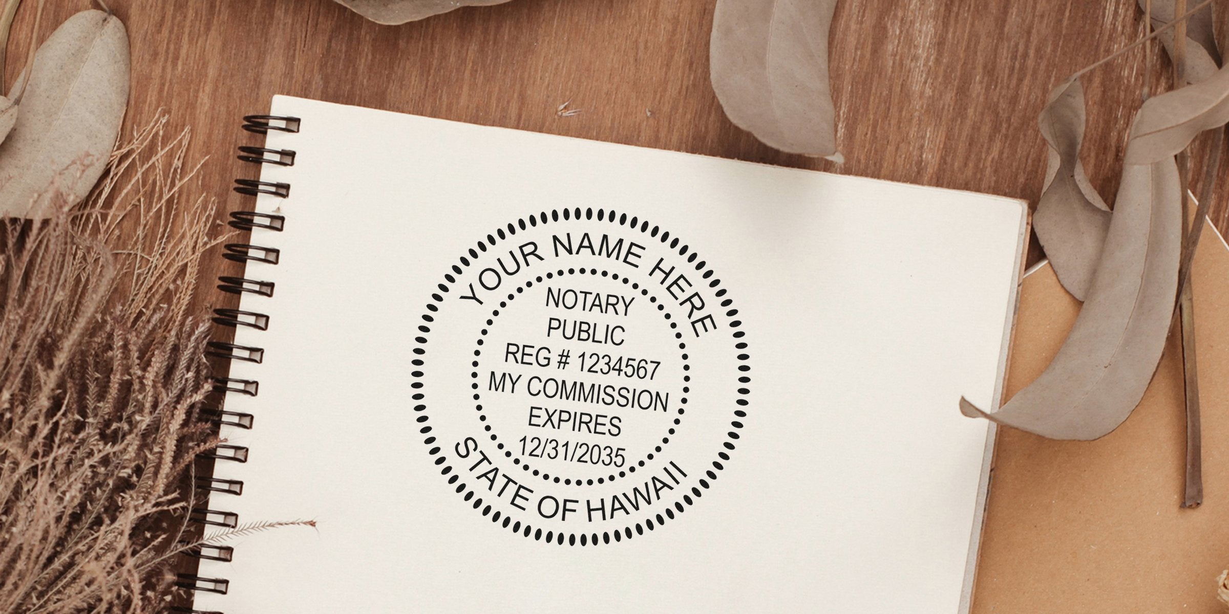Notary public round stamp mockup on a spiral notebook reading "Your Name Here, Notary Public, Reg #1234567, My Commission Expires 12/31/2035, State of Hawaii" with dried leaves and wood background