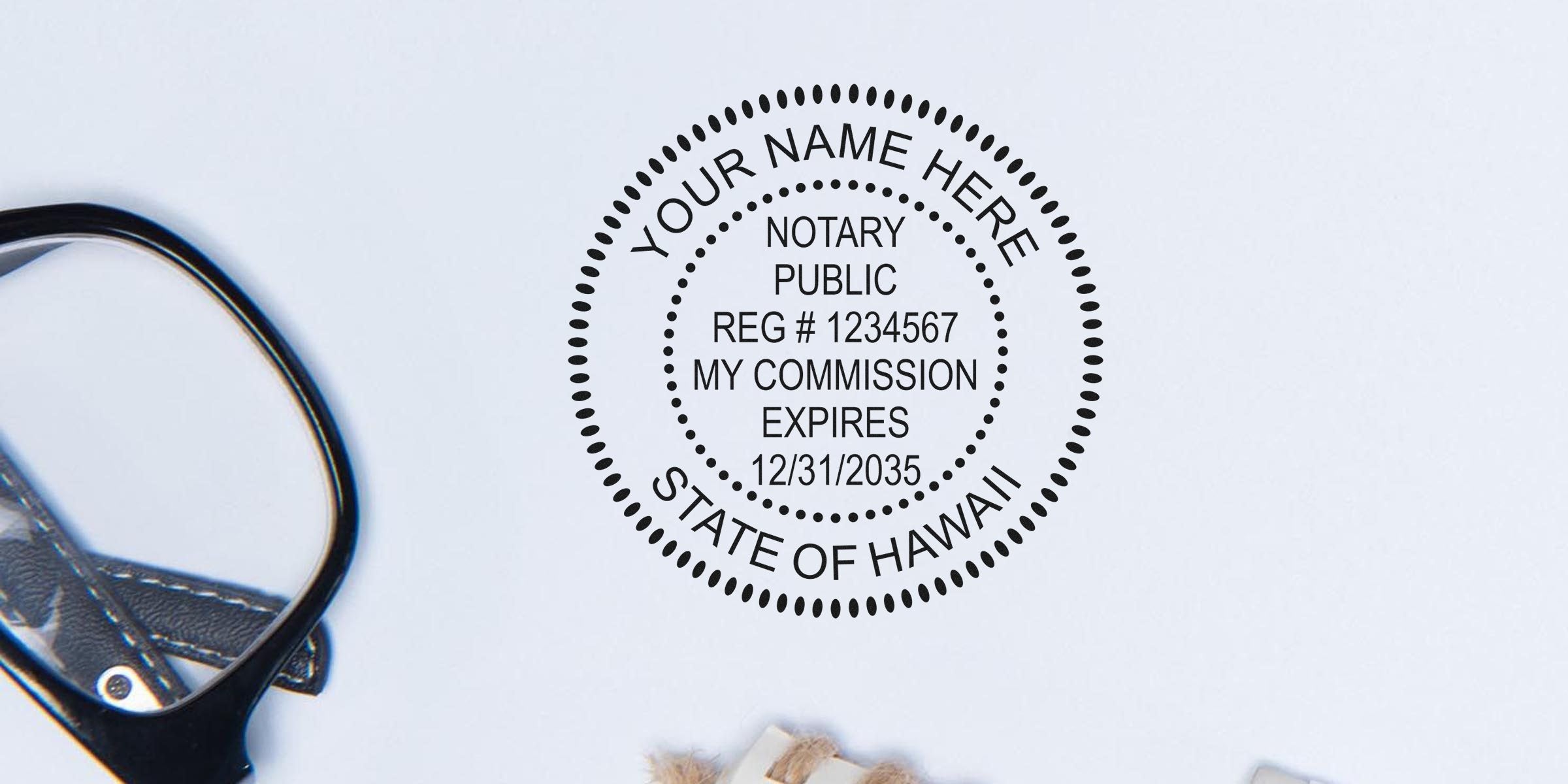 Round notary public stamp mockup reading "Your Name Here, Notary Public, Reg #1234567, My Commission Expires 12/31/2035, State of Hawaii" on white background with a magnifying glass and leather key strap.