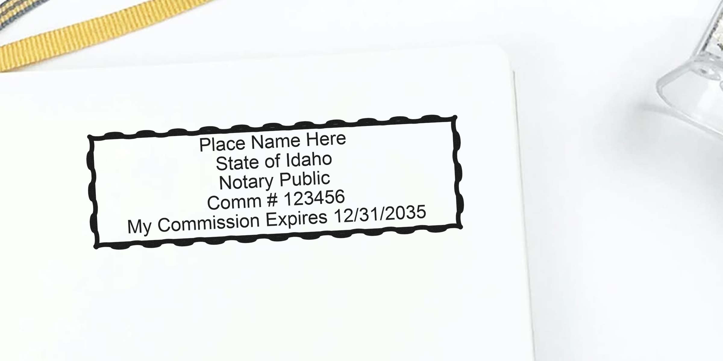 Customizable Idaho notary public stamp template on white paper showing placeholder name, Comm #123456 and commission expiration 12/31/2035
