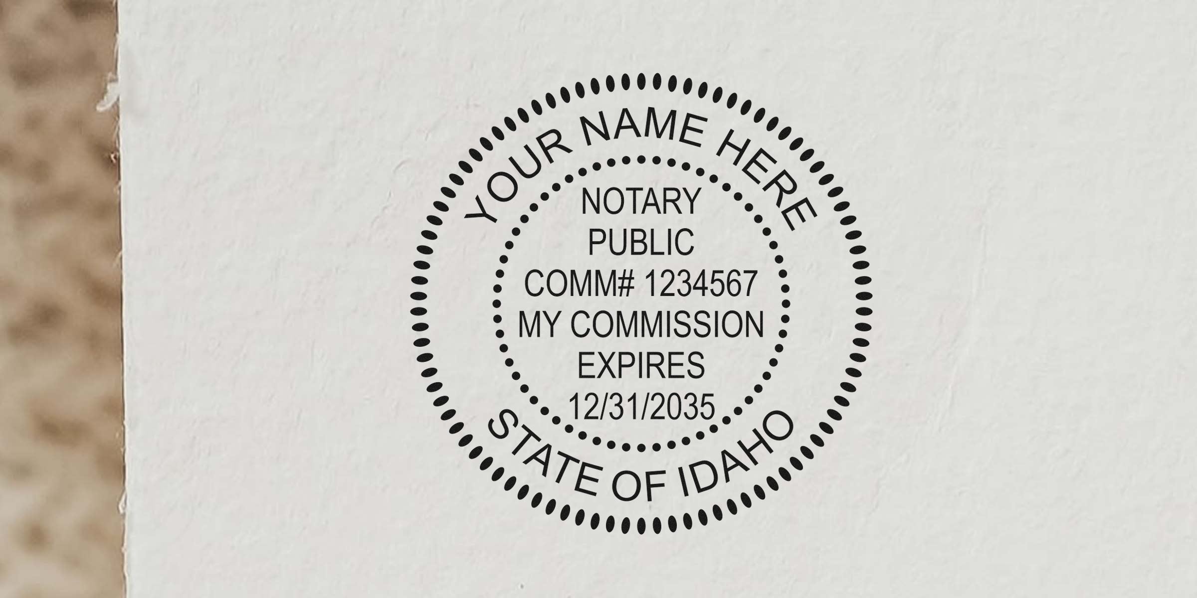 Round black notary public seal stamped on white paper reading "Your Name Here, Notary Public, Comm# 1234567, My Commission Expires 12/31/2035, State of Idaho."