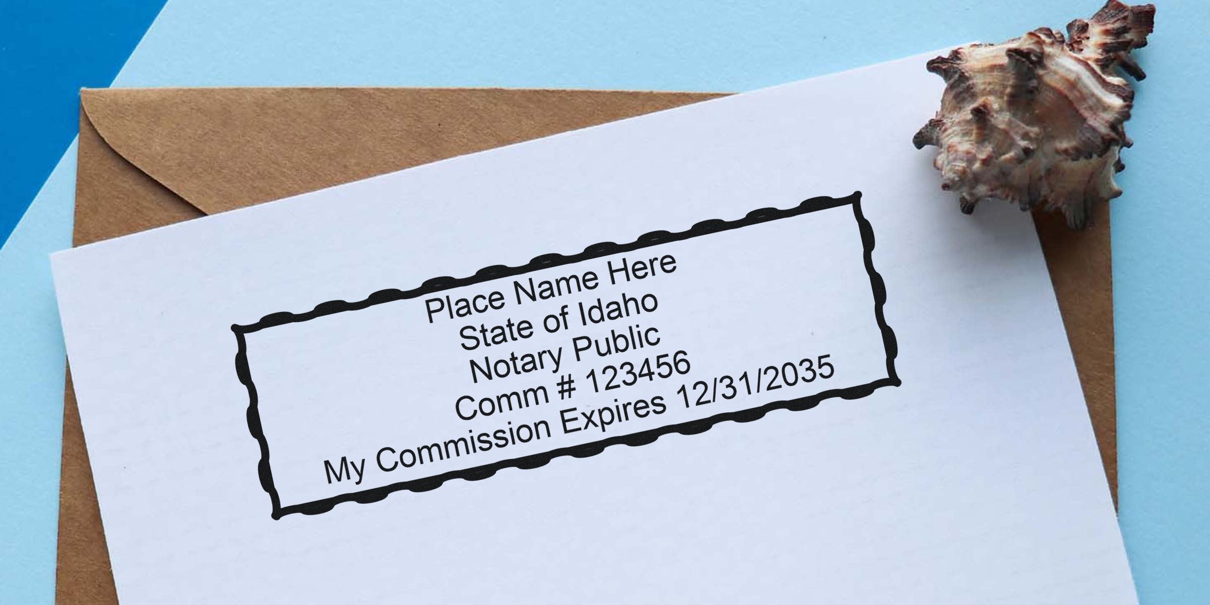 Idaho notary public stamp template on white paper with placeholder name and commission number, seashell accent, kraft envelope and blue background — notary stamp image for notary public, commission expiration mockup.