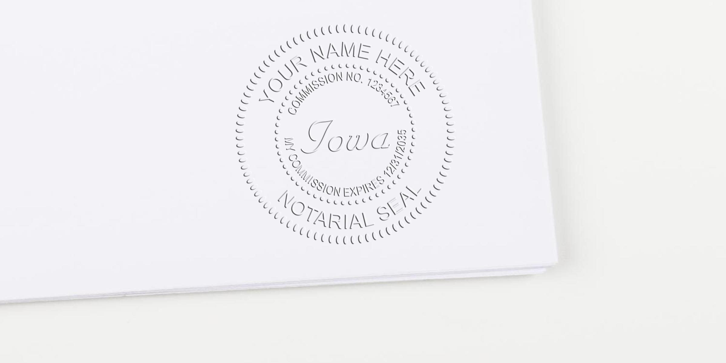 Embossed notarial seal on white paper reading "Iowa" with circular "Notarial Seal" and placeholder "Your Name Here" and commission details