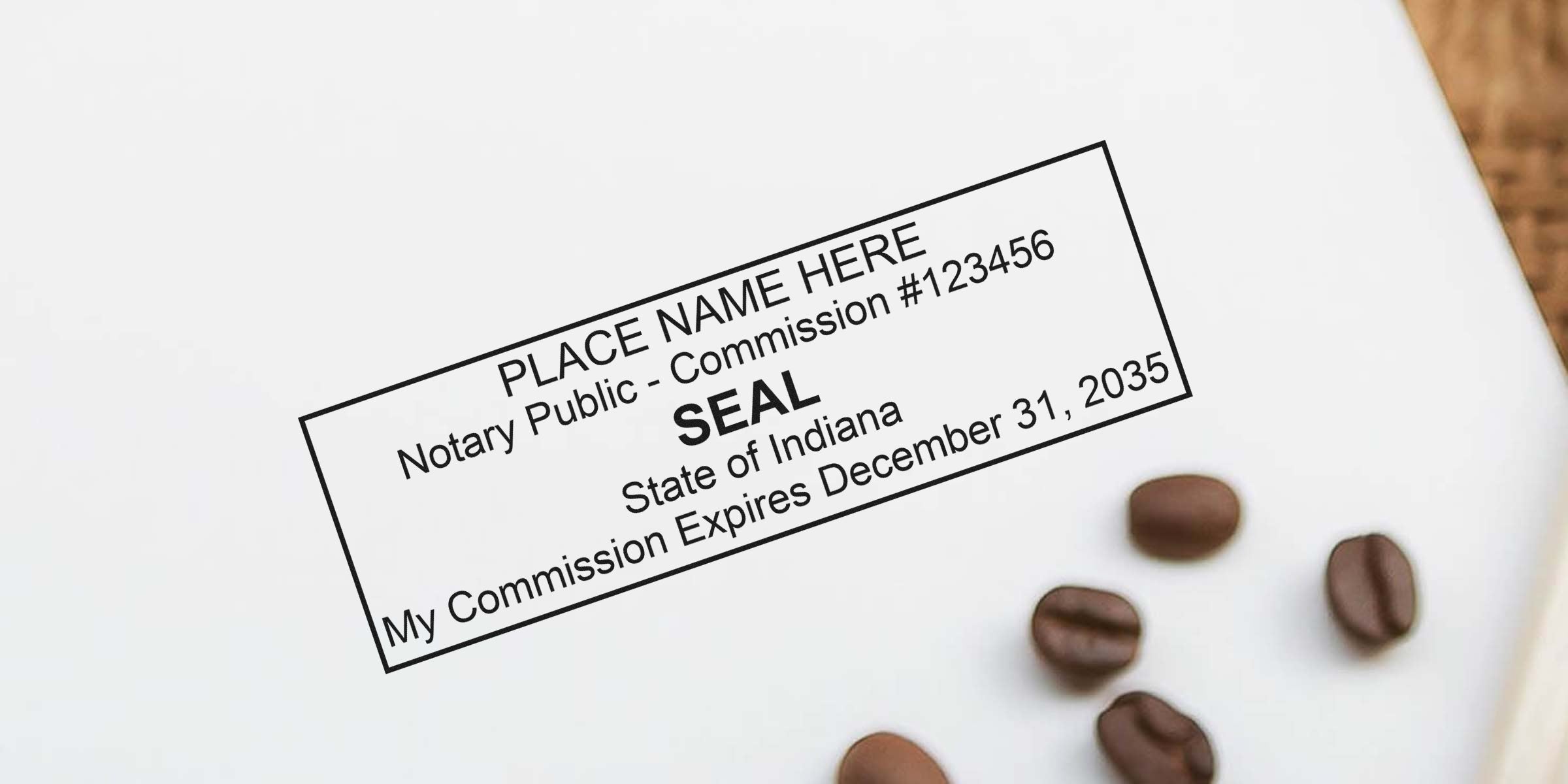Mock notary public seal stamp reading "PLACE NAME HERE", "Notary Public", State of Indiana, commission expires December 31, 2035 on white paper with scattered coffee beans