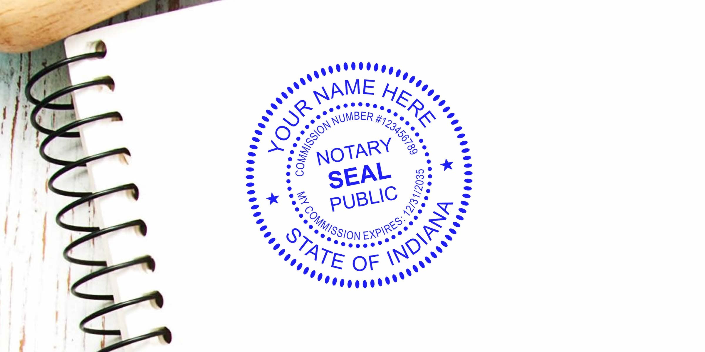 Blue circular notary public seal stamp reading "State of Indiana" on white paper beside a black spiral-bound notebook, close-up.