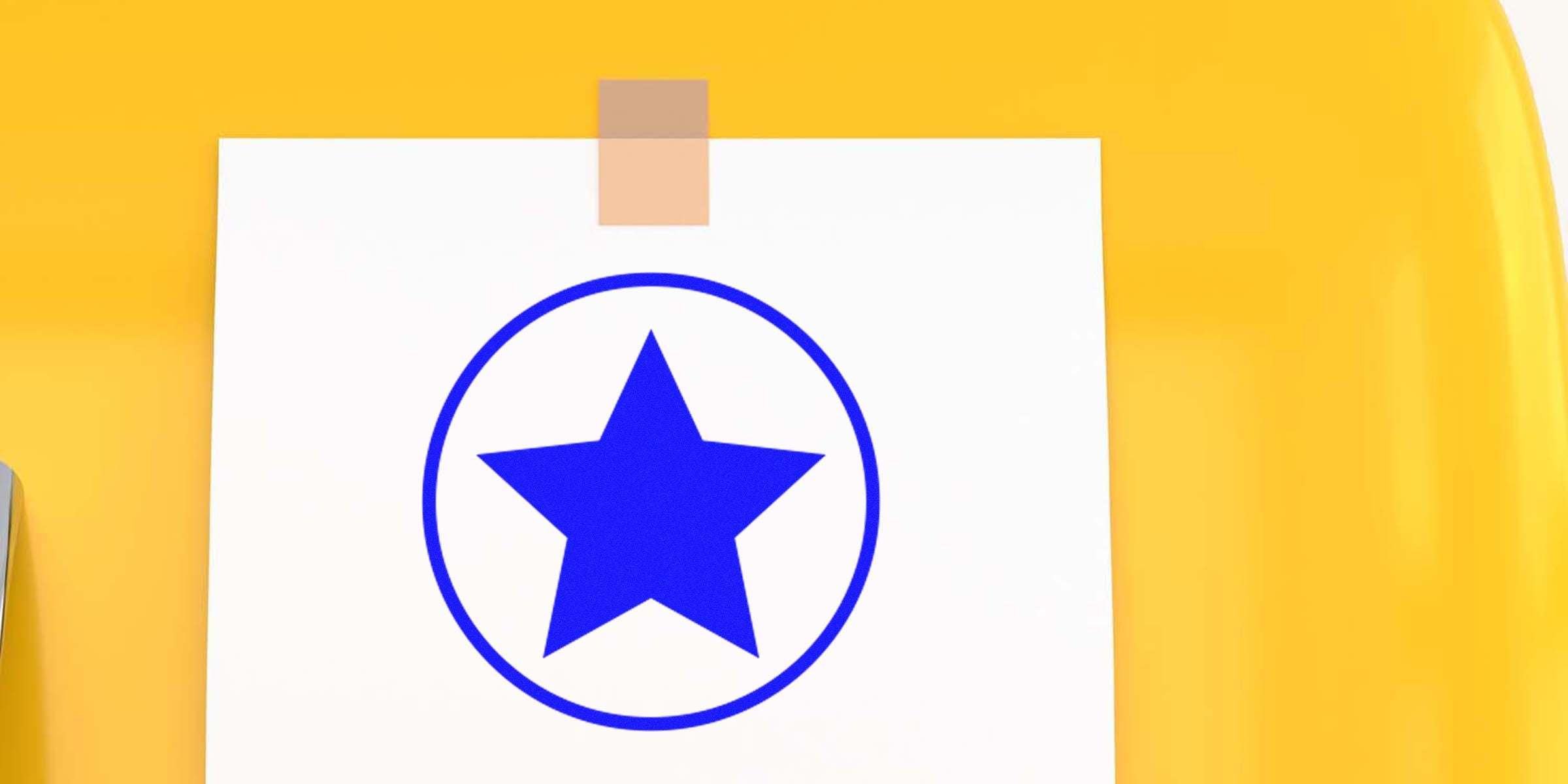 White paper with a blue star inside a blue circle taped to a yellow surface.