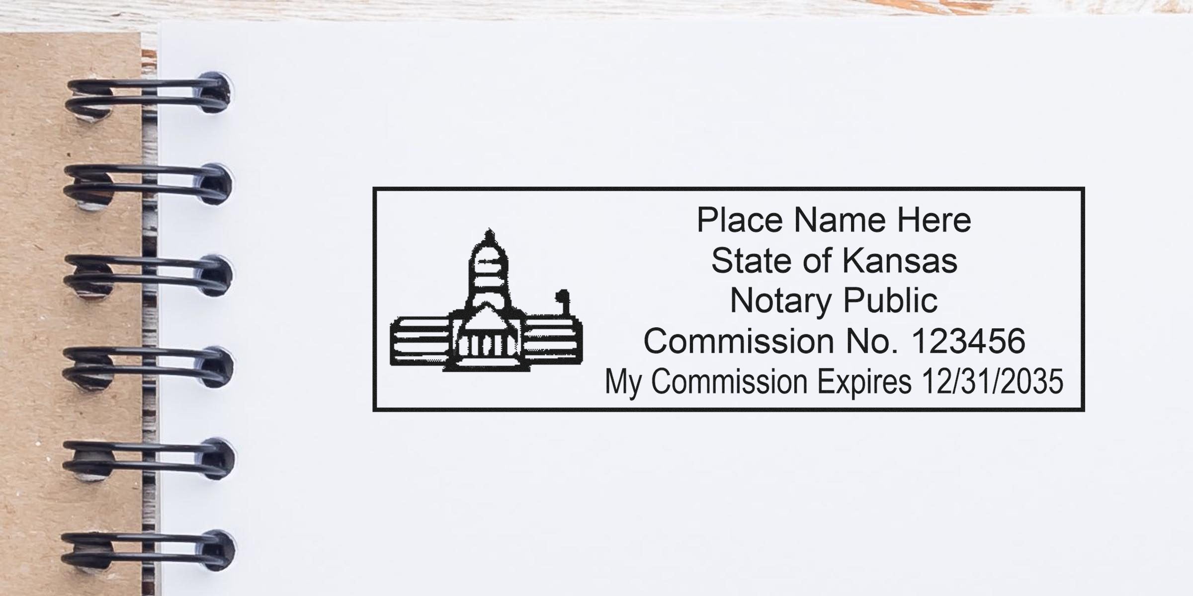 Kansas notary public stamp mockup on spiral notebook paper, rectangular seal with state capitol icon, placeholder name, commission no. 123456 and expiration 12/31/2035, black ink design