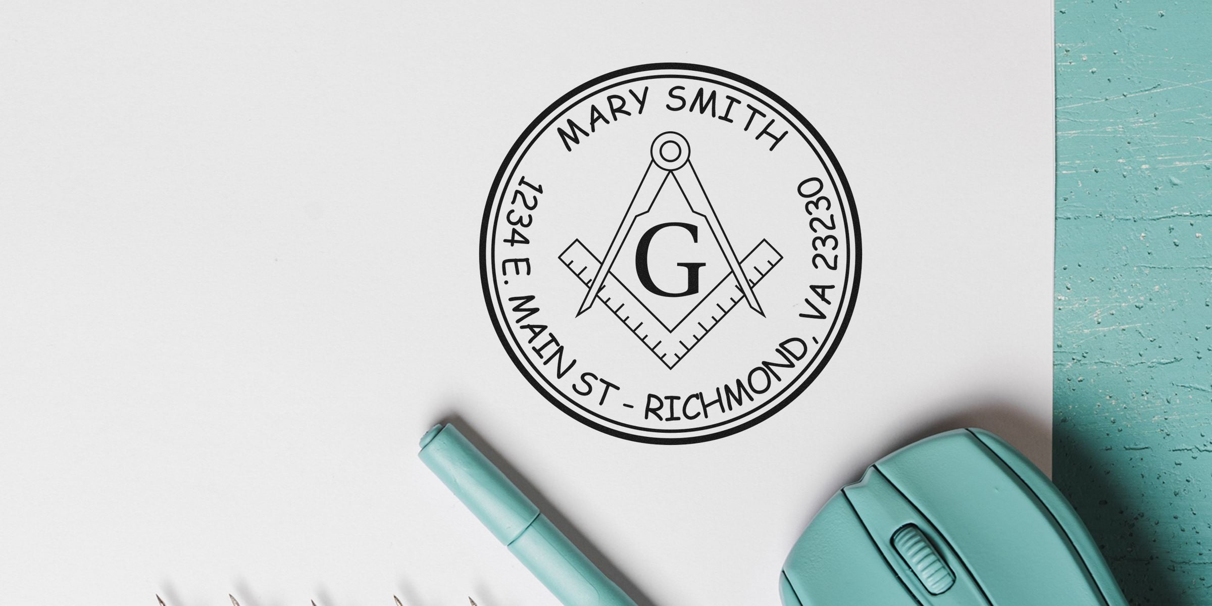 Circular Masonic seal with square and compasses and the letter G, surrounded by the text “Mary Smith” and the address “1234 E Main St, Richmond, VA 23230.”