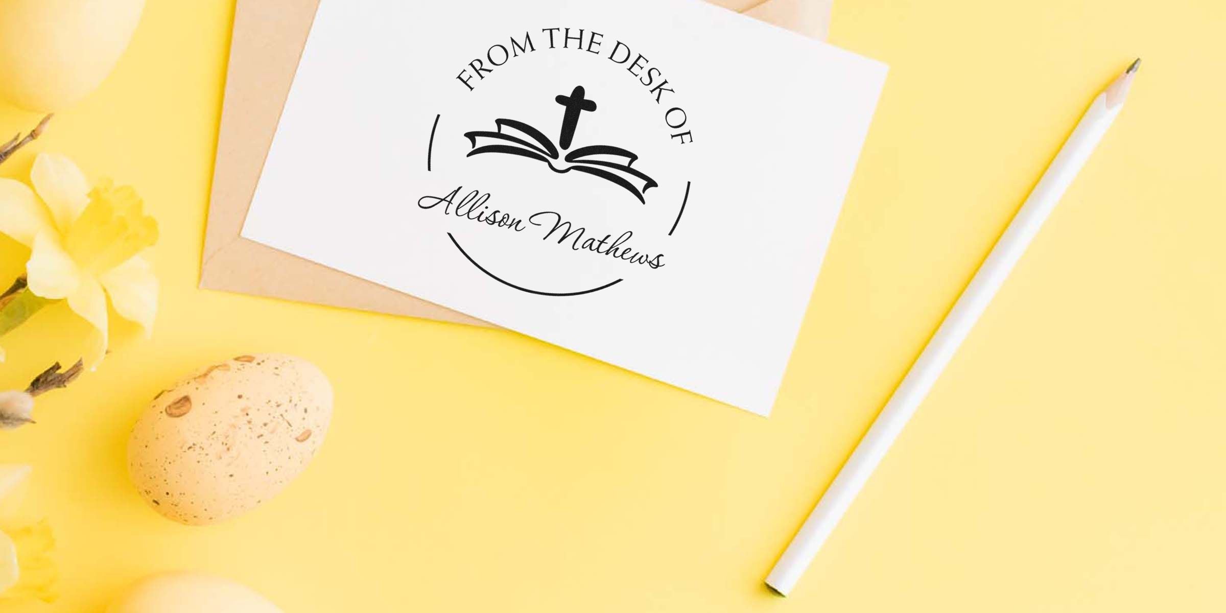 White card featuring a circular logo that says “From the Desk of Allison Mathews” with an open-book icon, on a yellow background with a pencil nearby.