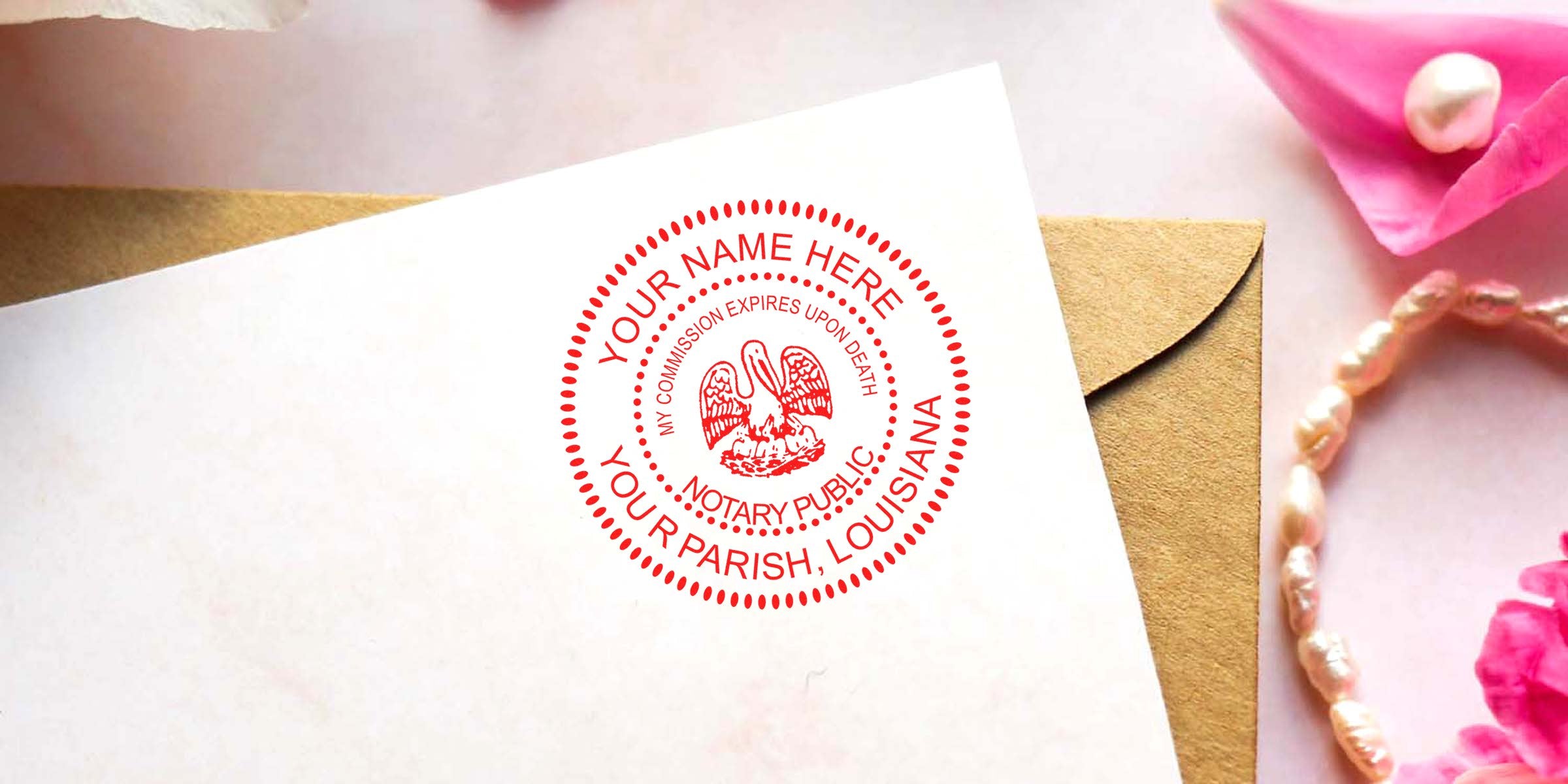 Red circular Louisiana notary public seal stamp with pelican emblem and placeholder name on white stationery overlapping a kraft envelope, with pink flowers and pearl bracelet nearby