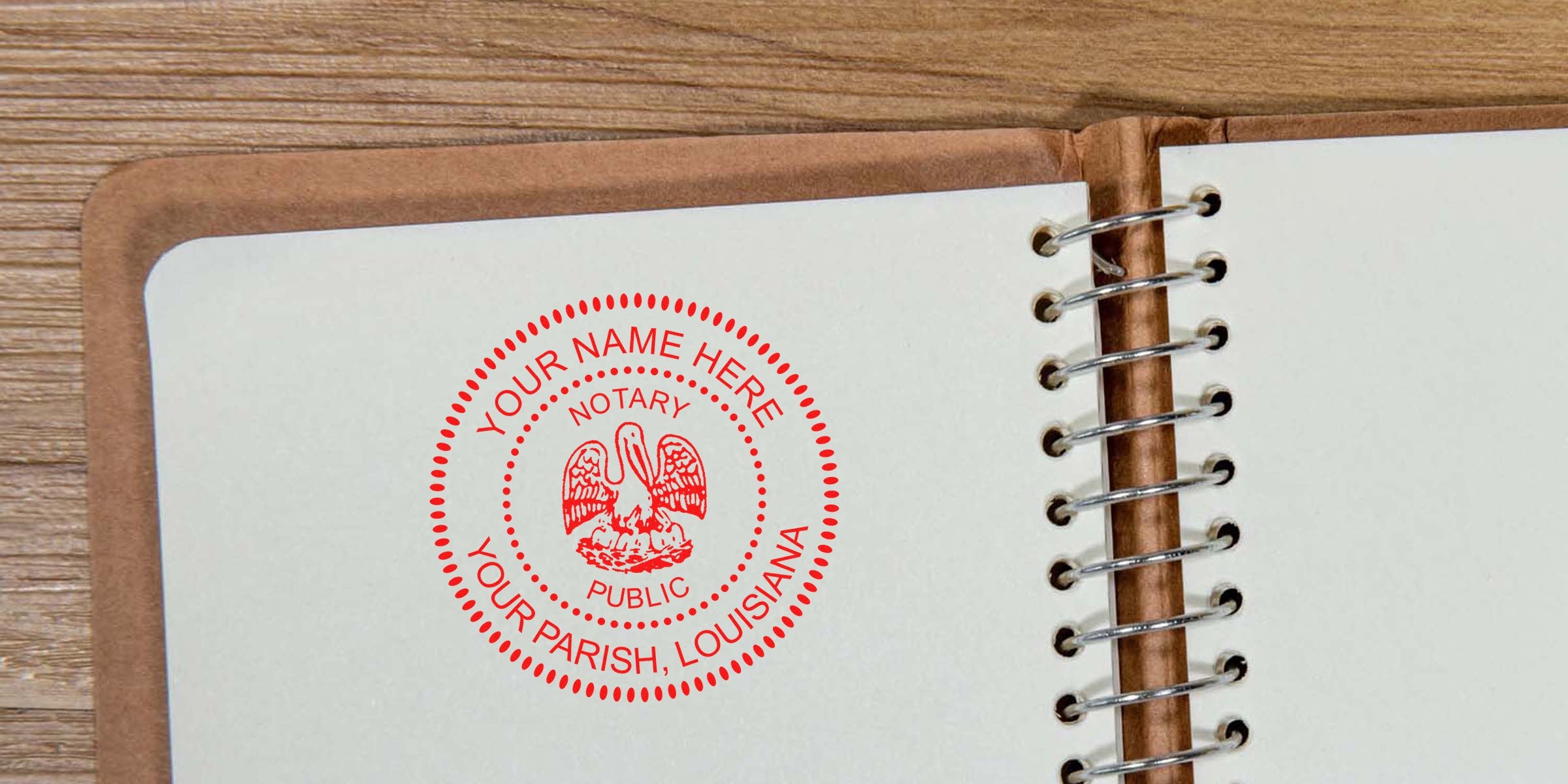 Red circular Louisiana notary public stamp mockup reading "Your Name Here, Your Parish, Louisiana" stamped on an open spiral-bound notebook page on a wooden desk