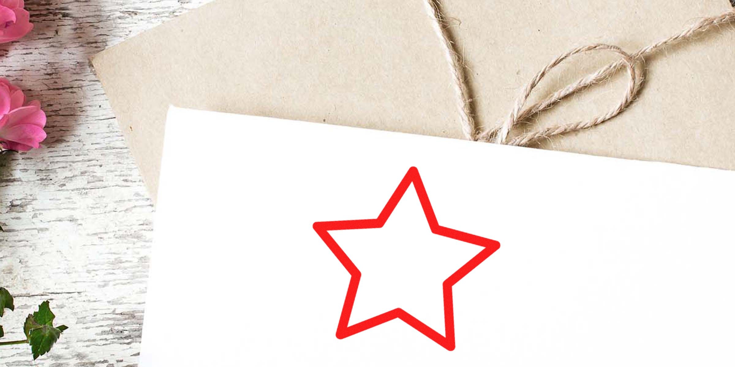 Red outline of a star on a white card.