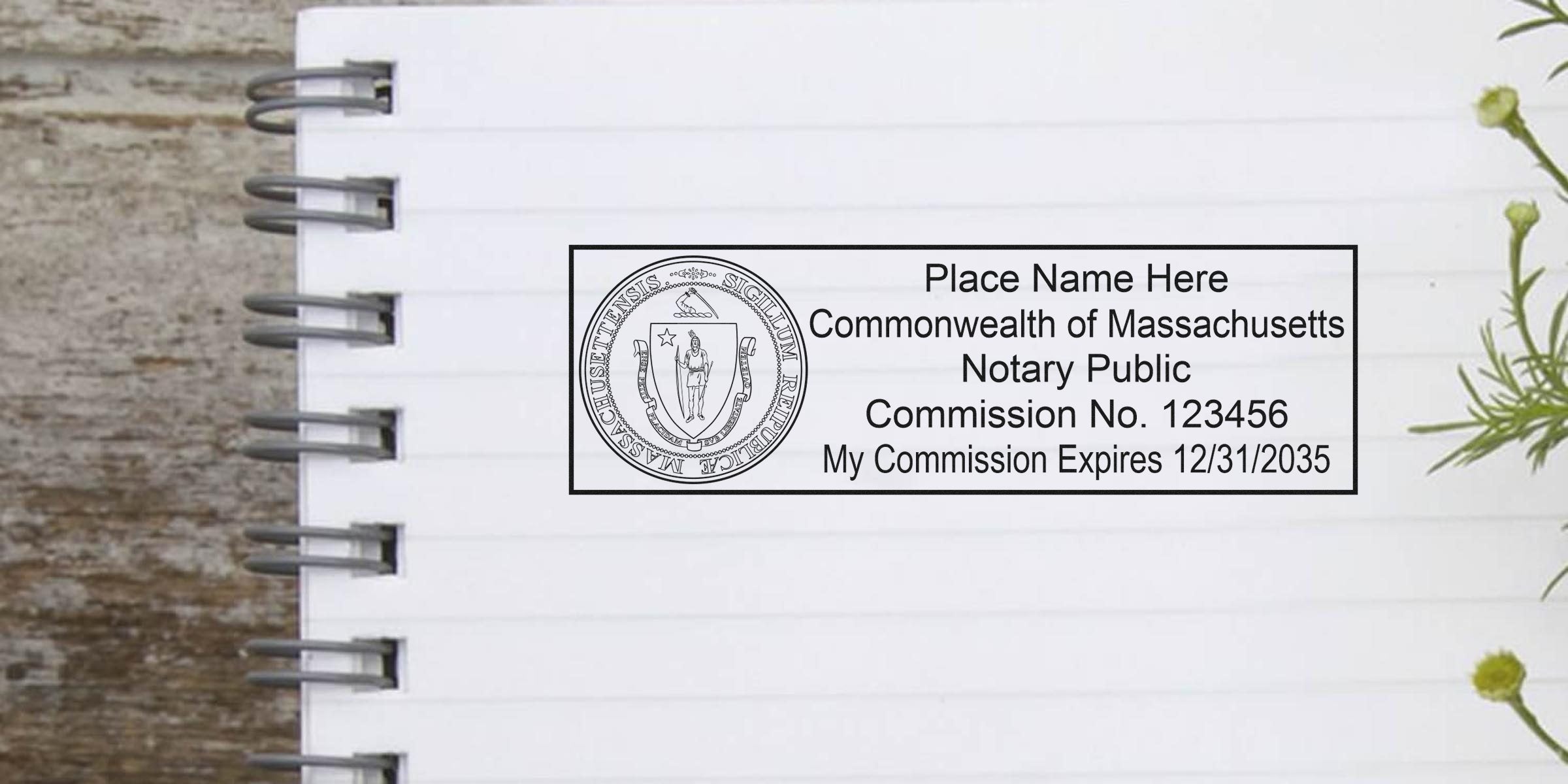 Massachusetts notary public rectangular stamp mockup with state seal, placeholder name, commission number and expiration date on a lined notebook page with rustic wood background and small green sprig
