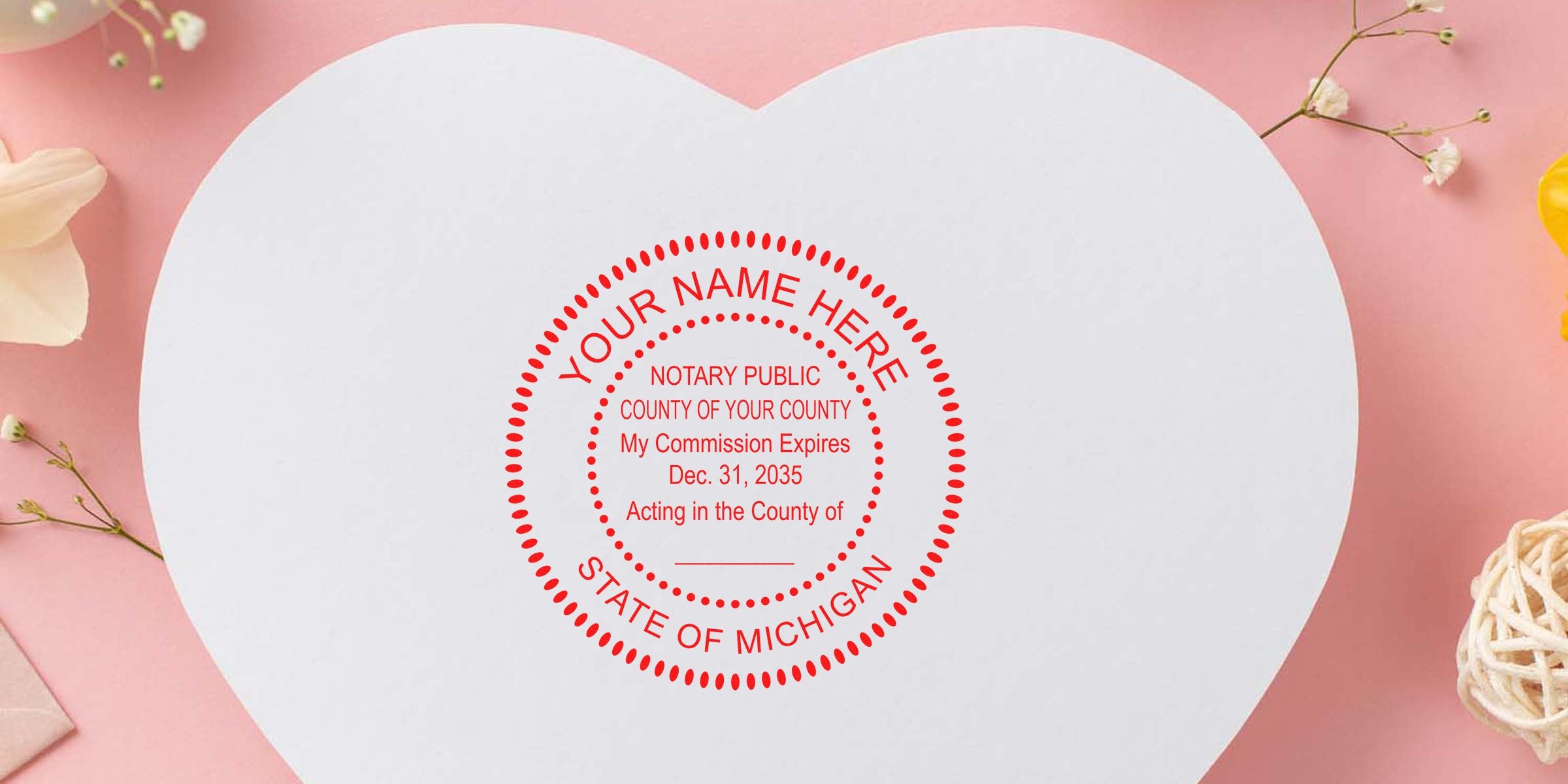 Heart-shaped white card on pink background with red circular Notary Public stamp reading "State of Michigan", surrounded by small flowers and decorative twine.