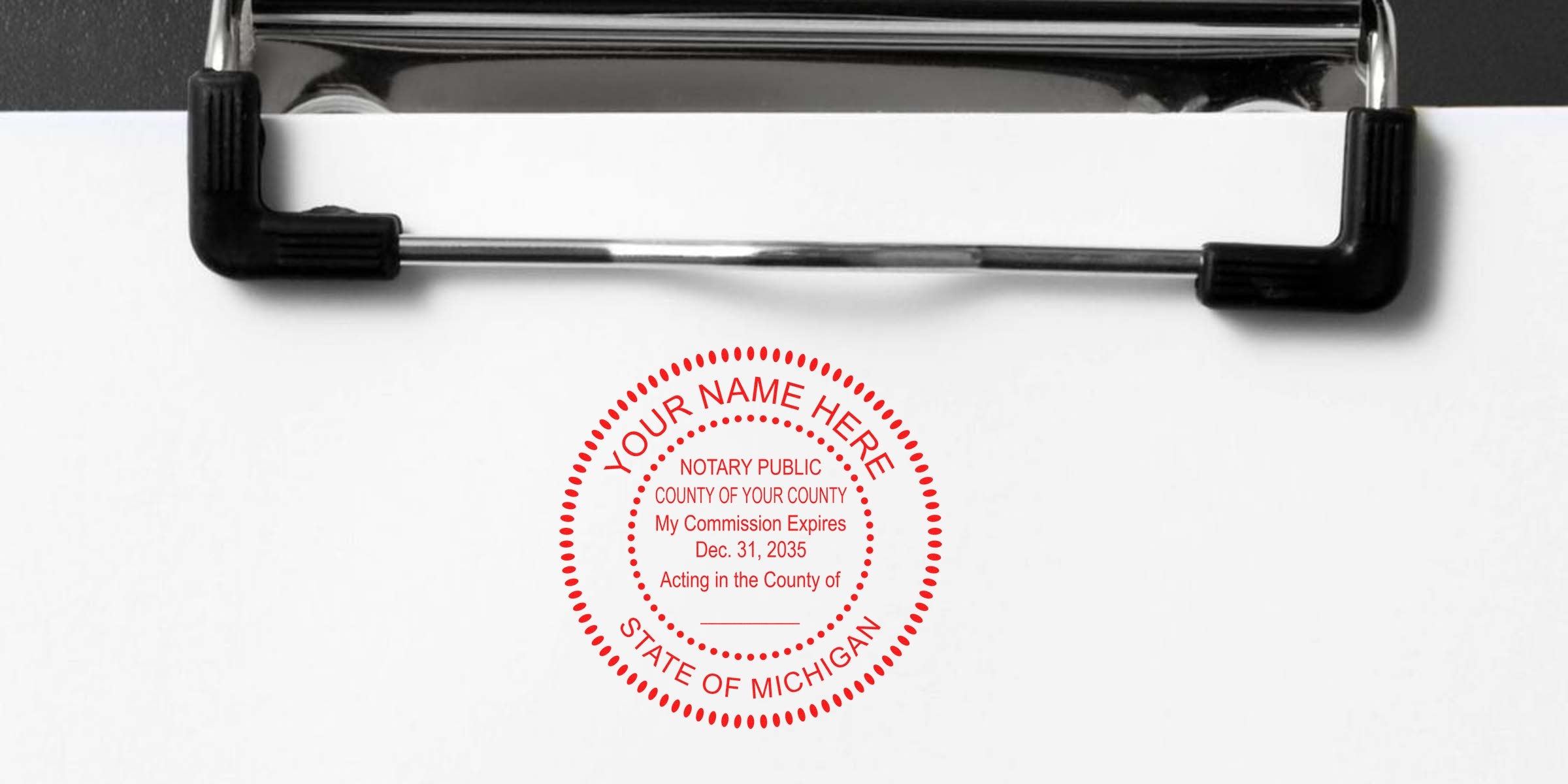 Red circular notary seal stamp on white paper clipped to a black metal clipboard, customizable text reading "State of Michigan" and name placeholder