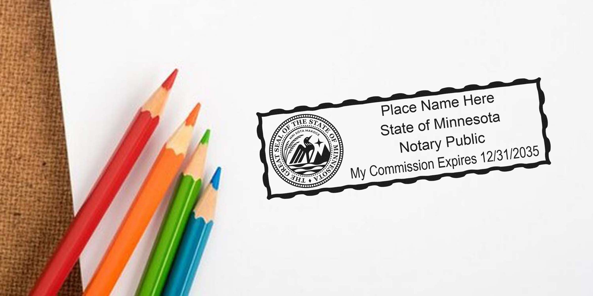 Colored pencils beside a Minnesota notary public stamp on white paper showing the state seal, placeholder name text and commission expiration date.