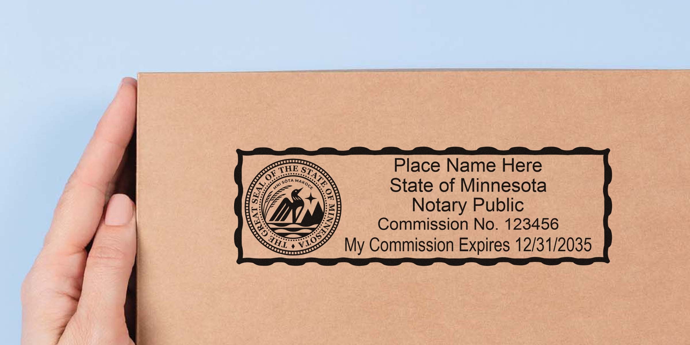 Hand holding a cardboard box stamped with a Minnesota notary rubber seal and placeholder text showing commission number and expiration date.