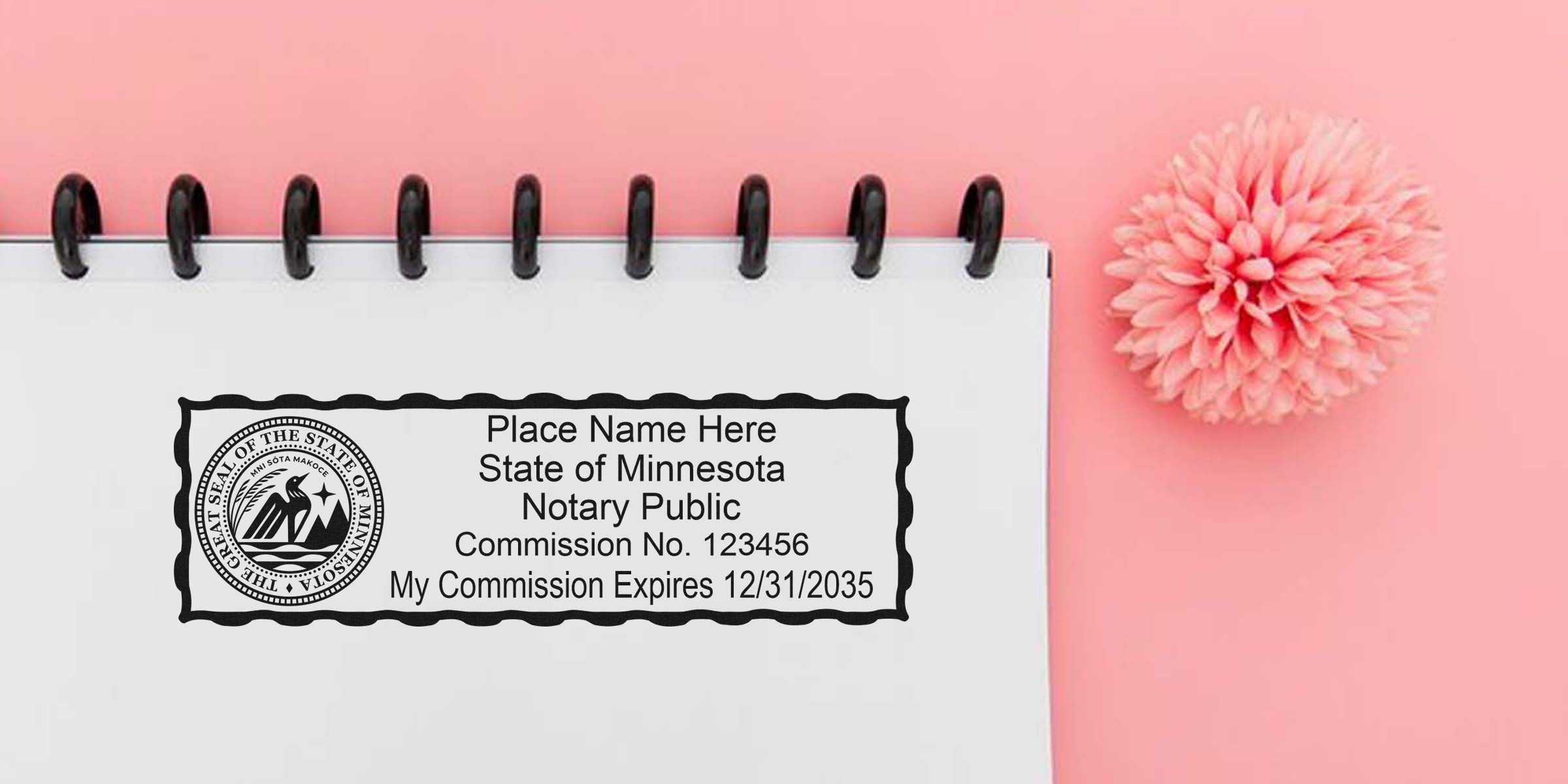 Close-up of Minnesota notary public stamp on a spiral notebook page showing state seal, commission number and expiration date, set on a pink background with a pink flower.