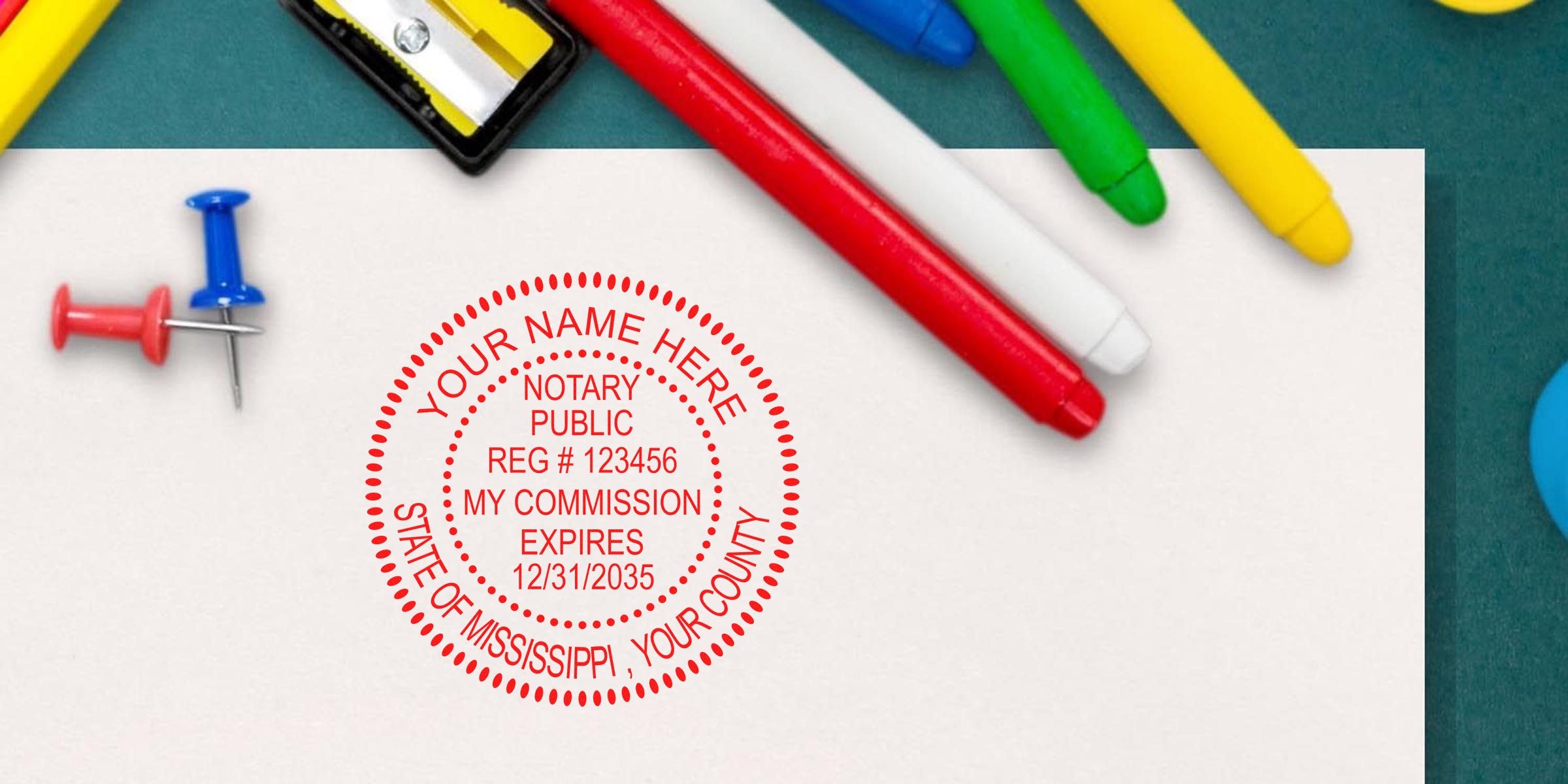 Red circular notary stamp seal on white paper reading "Notary Public" with commission details, surrounded by colorful markers, push pins and a sharpener
