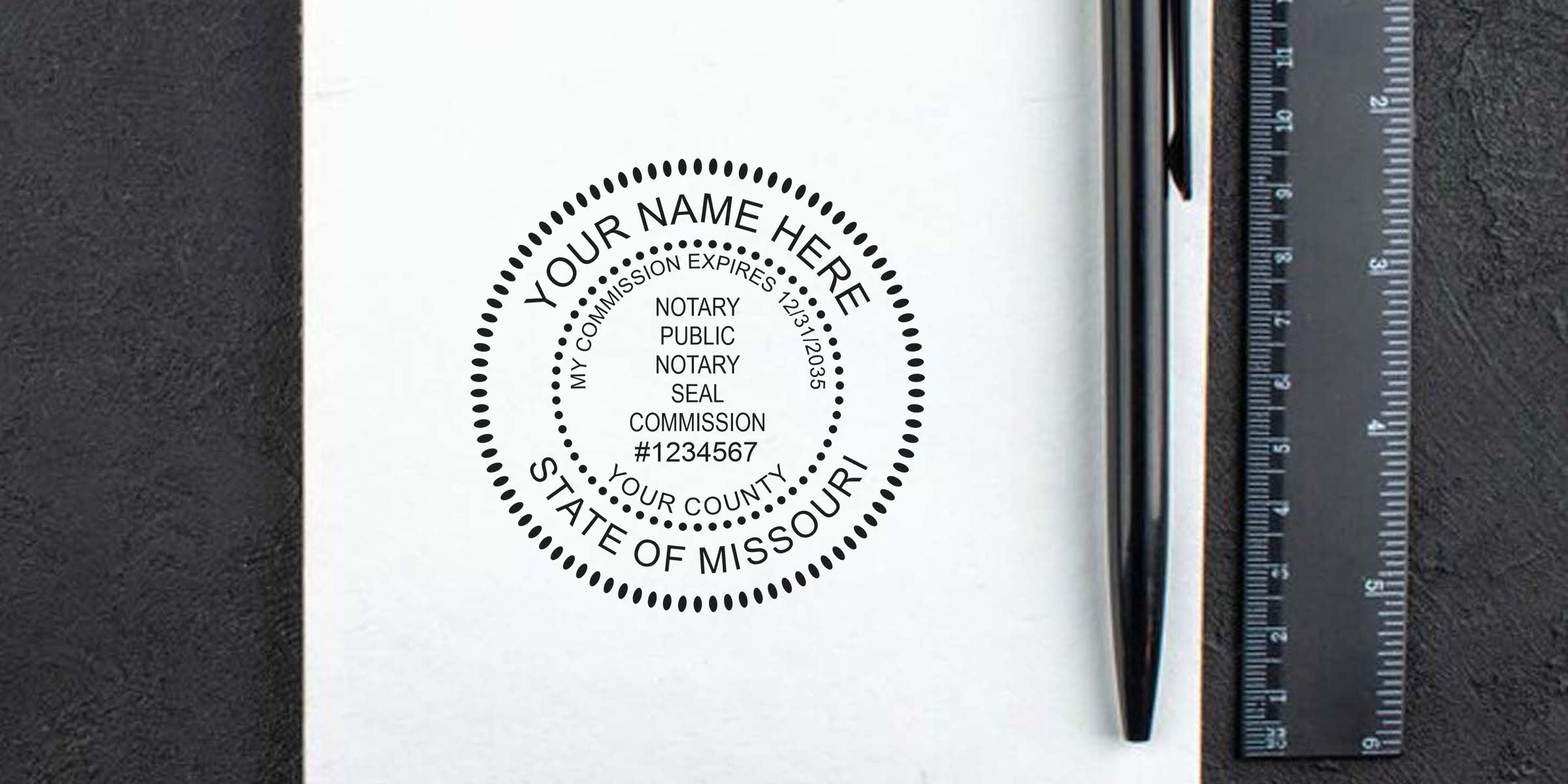 Missouri notary seal stamp mockup on white paper with placeholder "Your Name Here", circular dotted border, commission number and expiration date, black pen and ruler beside it — notary stamp mockup for legal documents and notary supplies