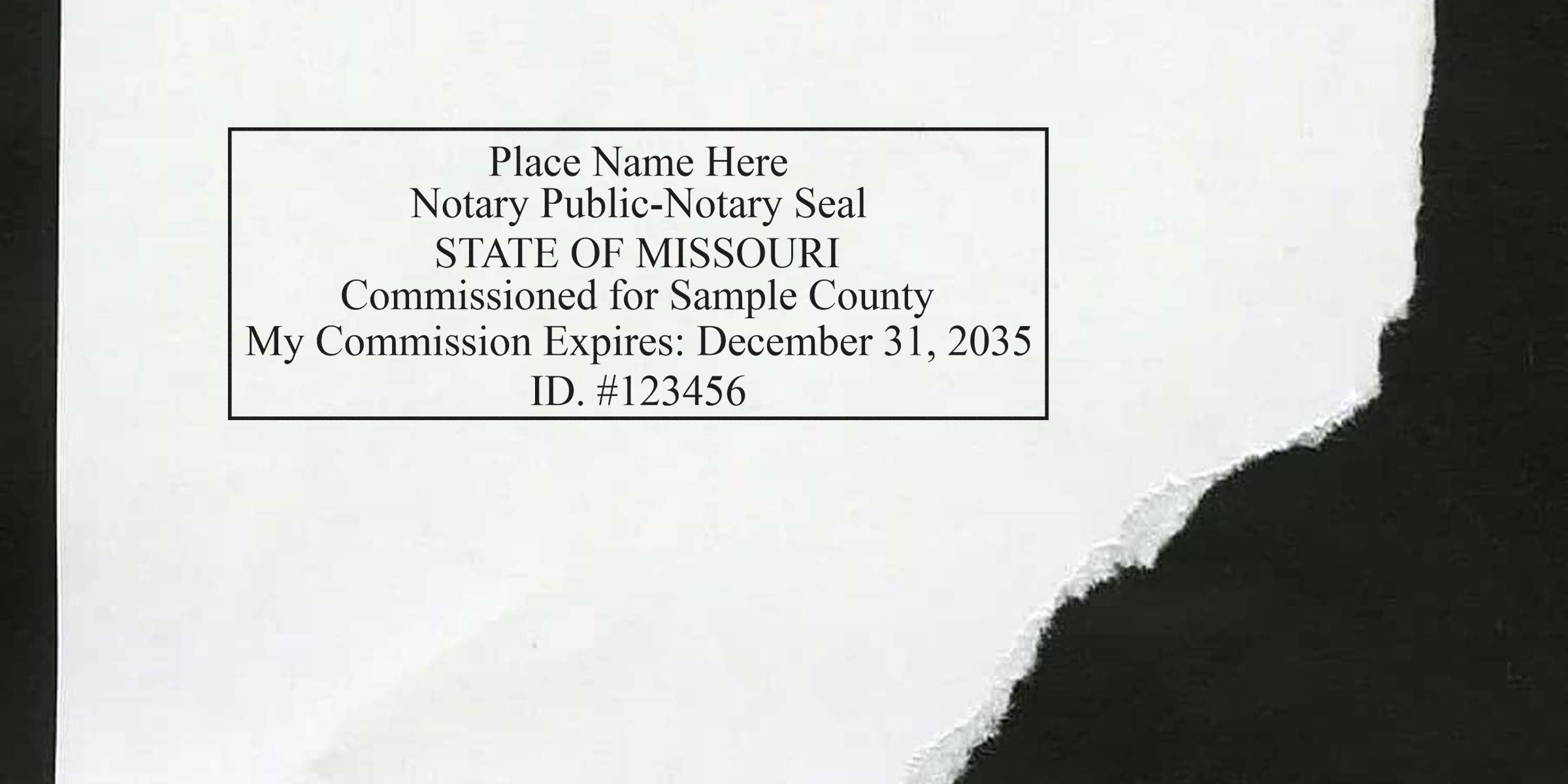 Rectangular notary public seal printed on torn white paper reading "Place Name Here Notary Public-Notary Seal STATE OF MISSOURI Commissioned for Sample County My Commission Expires: December 31, 2035 ID. #123456"