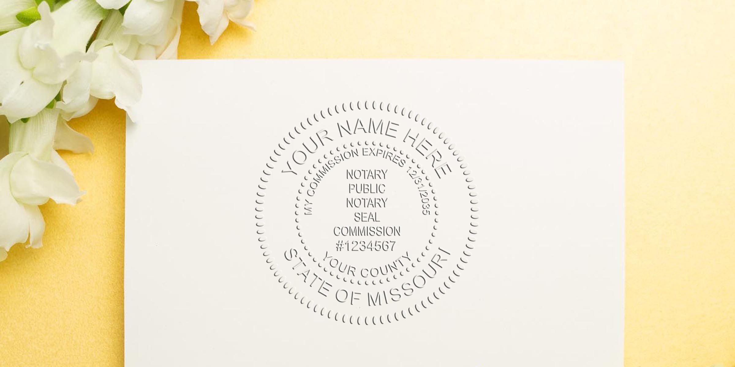 Embossed notary public seal impression on white cardstock reading "Your Name Here, State of Missouri" with white flowers on a yellow background